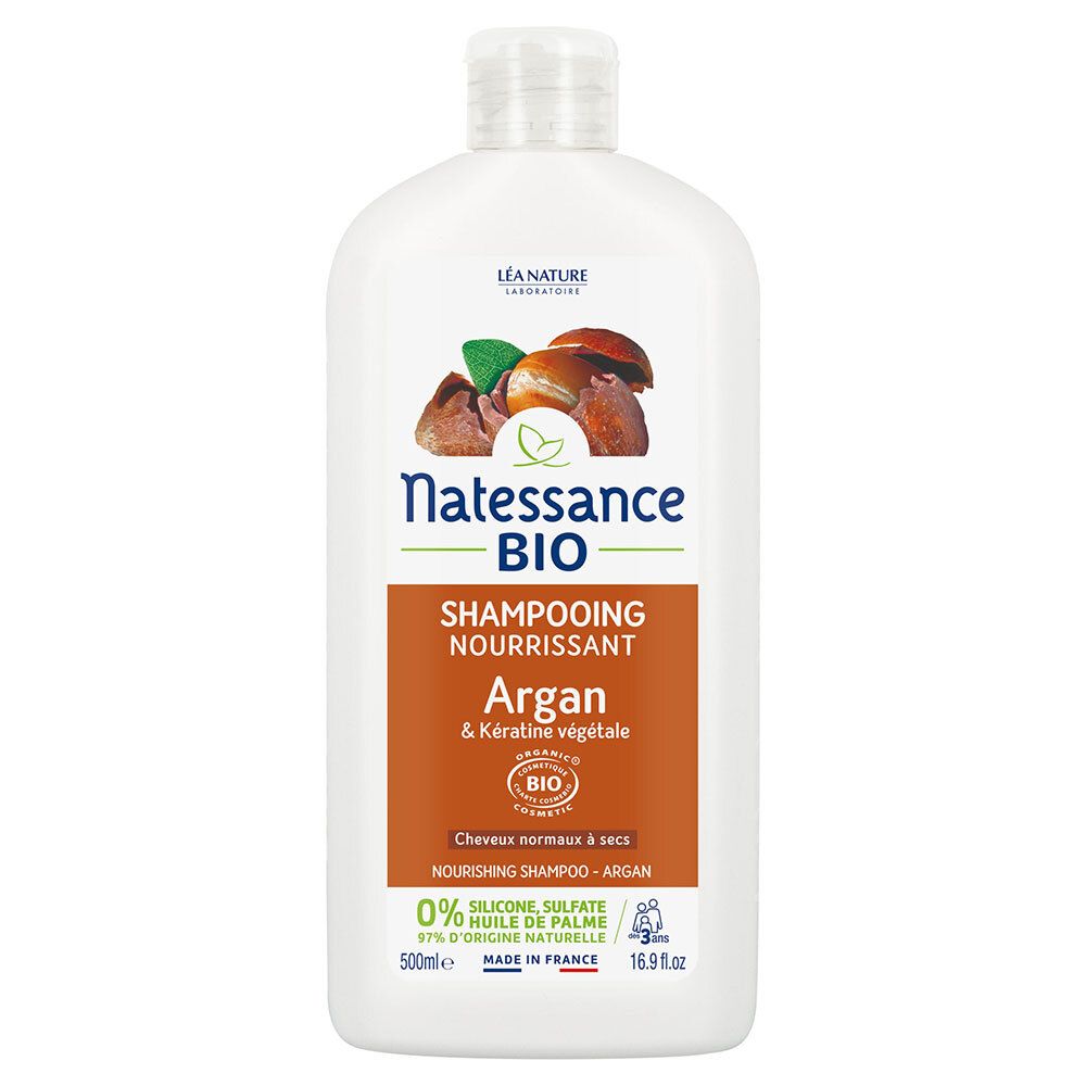 Flacon de shampooing blanc. Inscription: Natessance BIO, Shampooing Nourrissant, Argan & Kératine végétale. Certification bio.