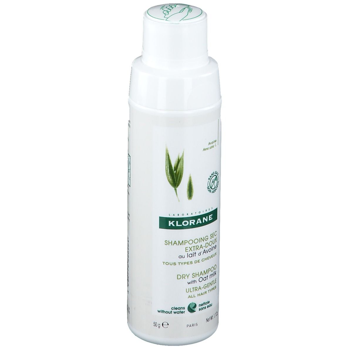 KLORANE Trockenshampoo mit Hafermilch. Weiße Flasche mit grünem Etikett. Text und Logo.