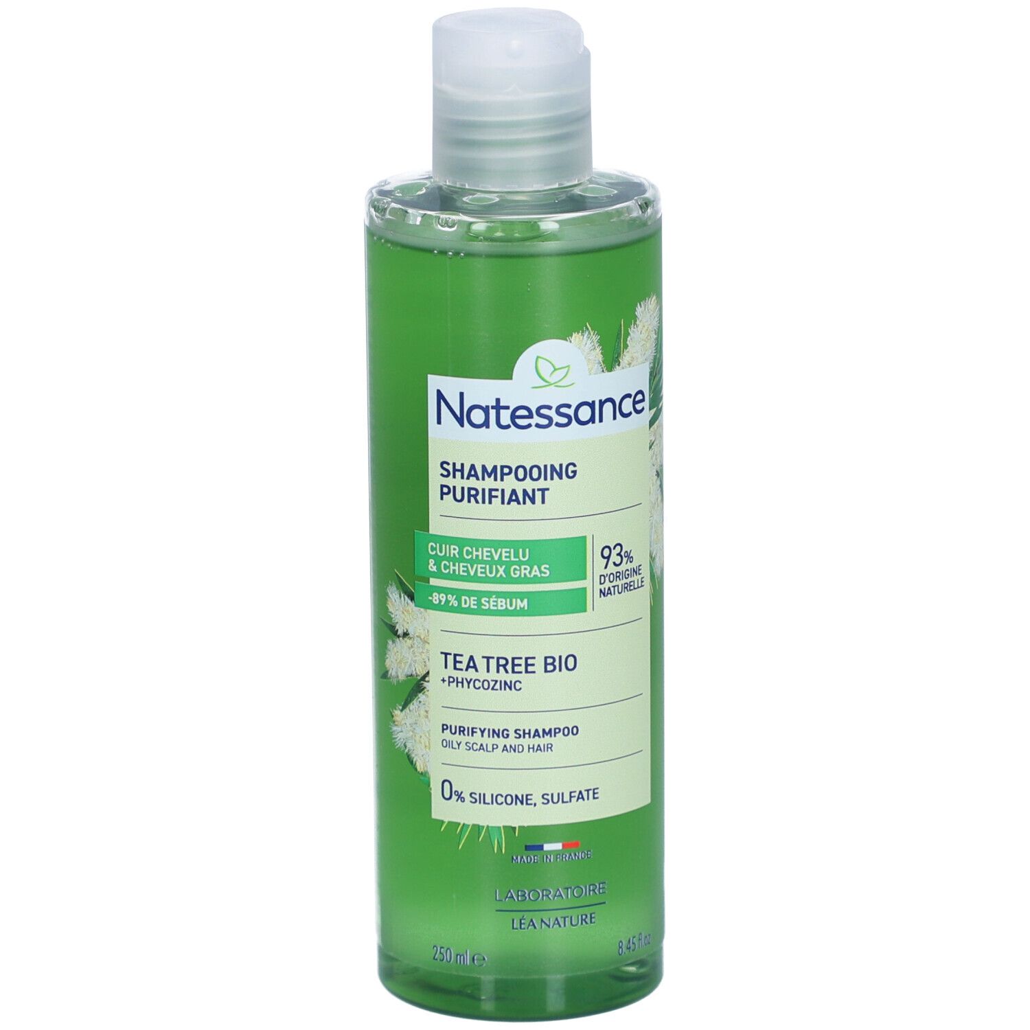 Grüne Shampoo-Flasche. Aufschrift: Natessance, Shampoing Purifiant, Tea Tree Bio. 93% natürliche Inhaltsstoffe. 0% Silikon, Sulfate.