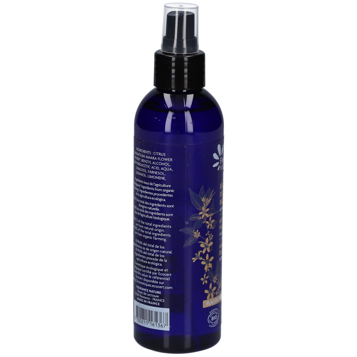 Bouteille bleue avec liste d'ingrédients. Inscription: CITRUS AURANTIUM AMARA FLOWER WATER, AQUA, LINALOOL, LIMONENE.