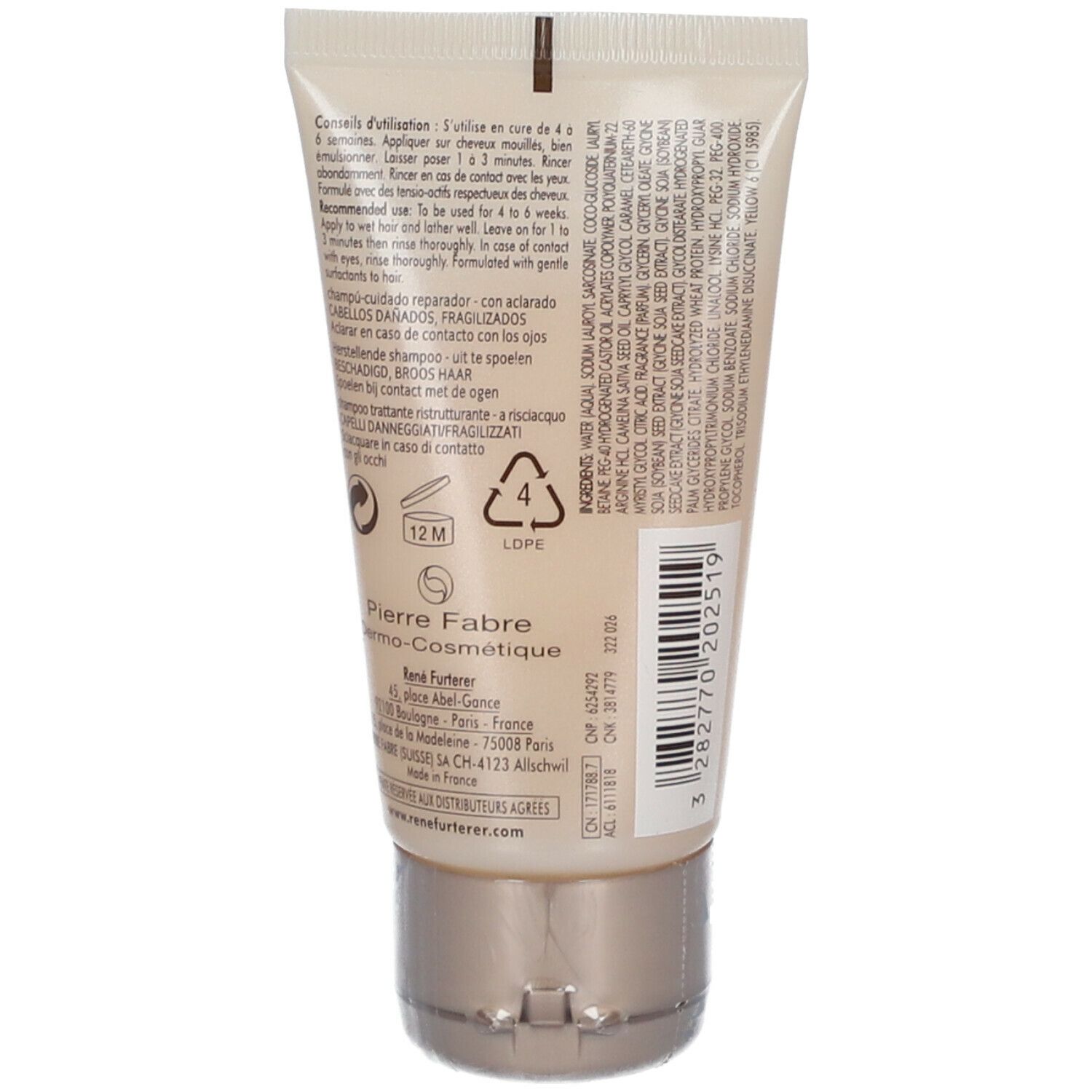 Dos d'un tube beige. Texte en plusieurs langues. Bouchon doré. Fabricant: Pierre Fabre.
