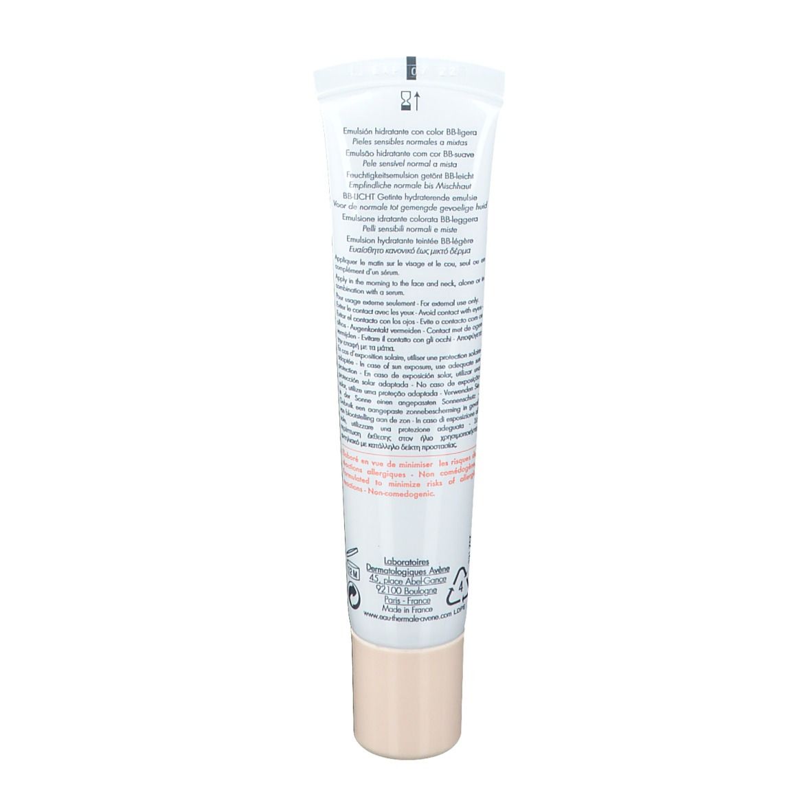Dos d'un tube blanc. Texte multilingue. Logos: 12M, symbole de recyclage. Bouchon beige.