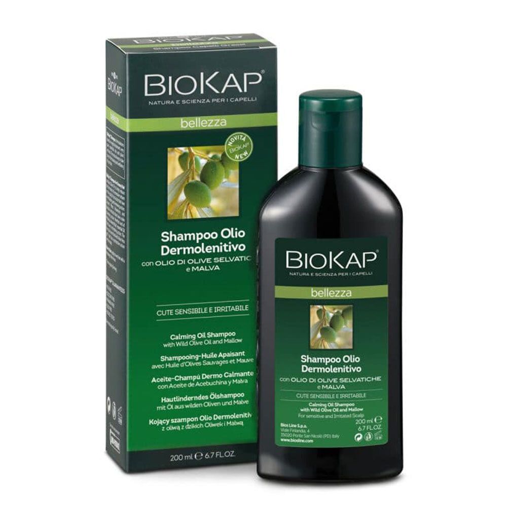Dunkle Flasche mit grünem Deckel und Verpackung. Aufschrift: BIOKAP, Shampoo Olio Dermolenitivo.