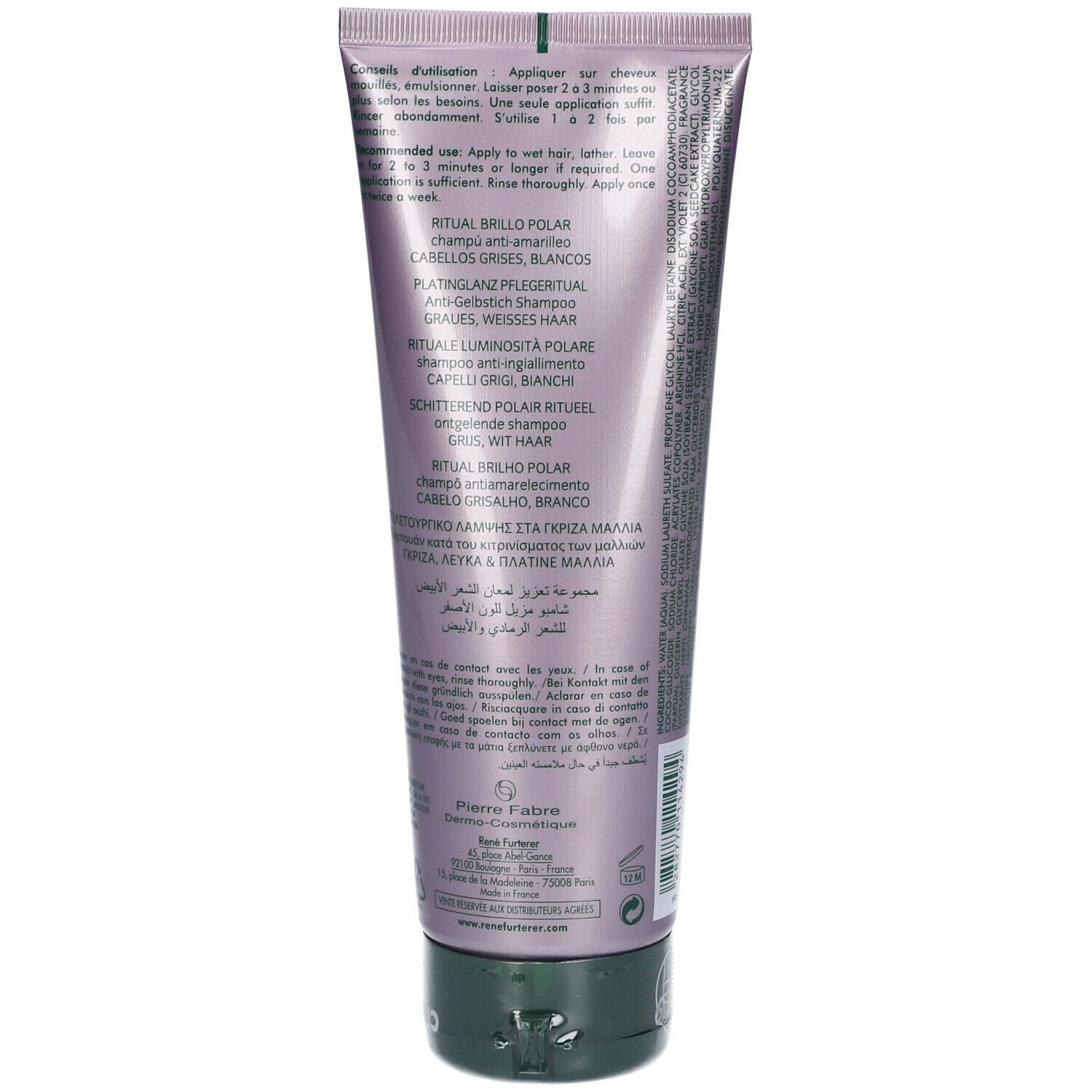 Dos d'un tube violet avec texte multilingue. Bouchon vert.