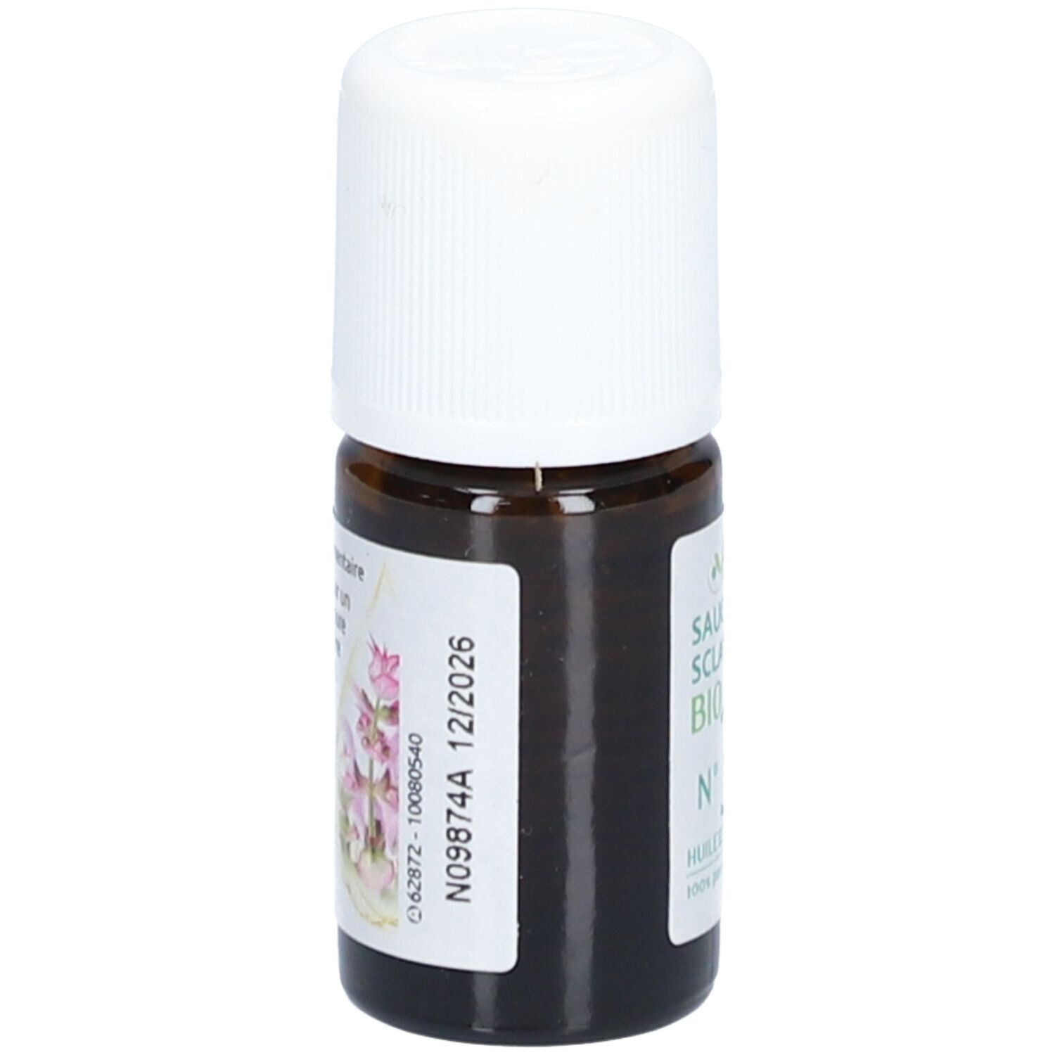 Braune Glasflasche mit weißem Deckel. Etikett mit Text und floralem Motiv. Aufgedrucktes Verfallsdatum: 12/2026.