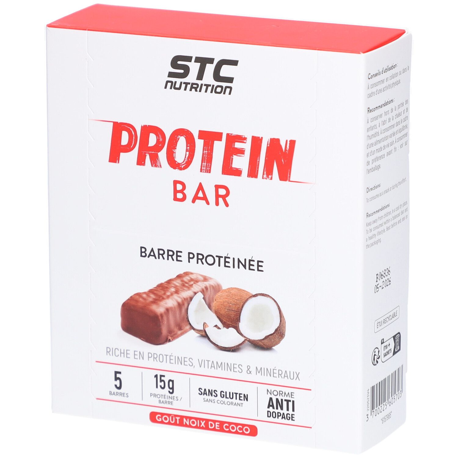 Weiße Verpackung mit rotem Deckel. Aufdruck: STC Nutrition, Protein Bar, Kokosnuss-Geschmack. Abbildung: Proteinriegel und Kokosnuss.