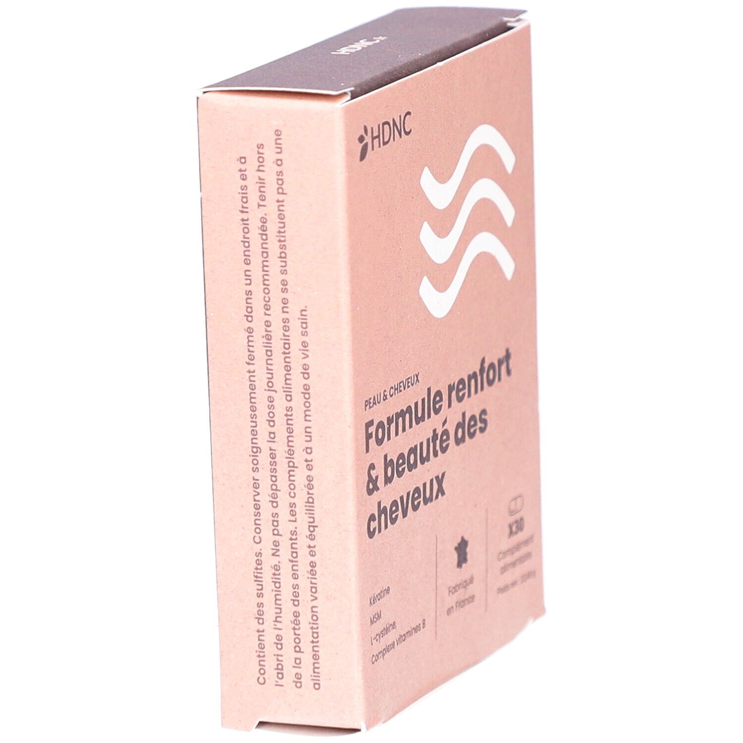 Schräg gestellte Kartonverpackung mit HDNC-Logo und Text: Formule renfort & beauté des cheveux. Enthält 30 Tabletten. Hergestellt in Frankreich.