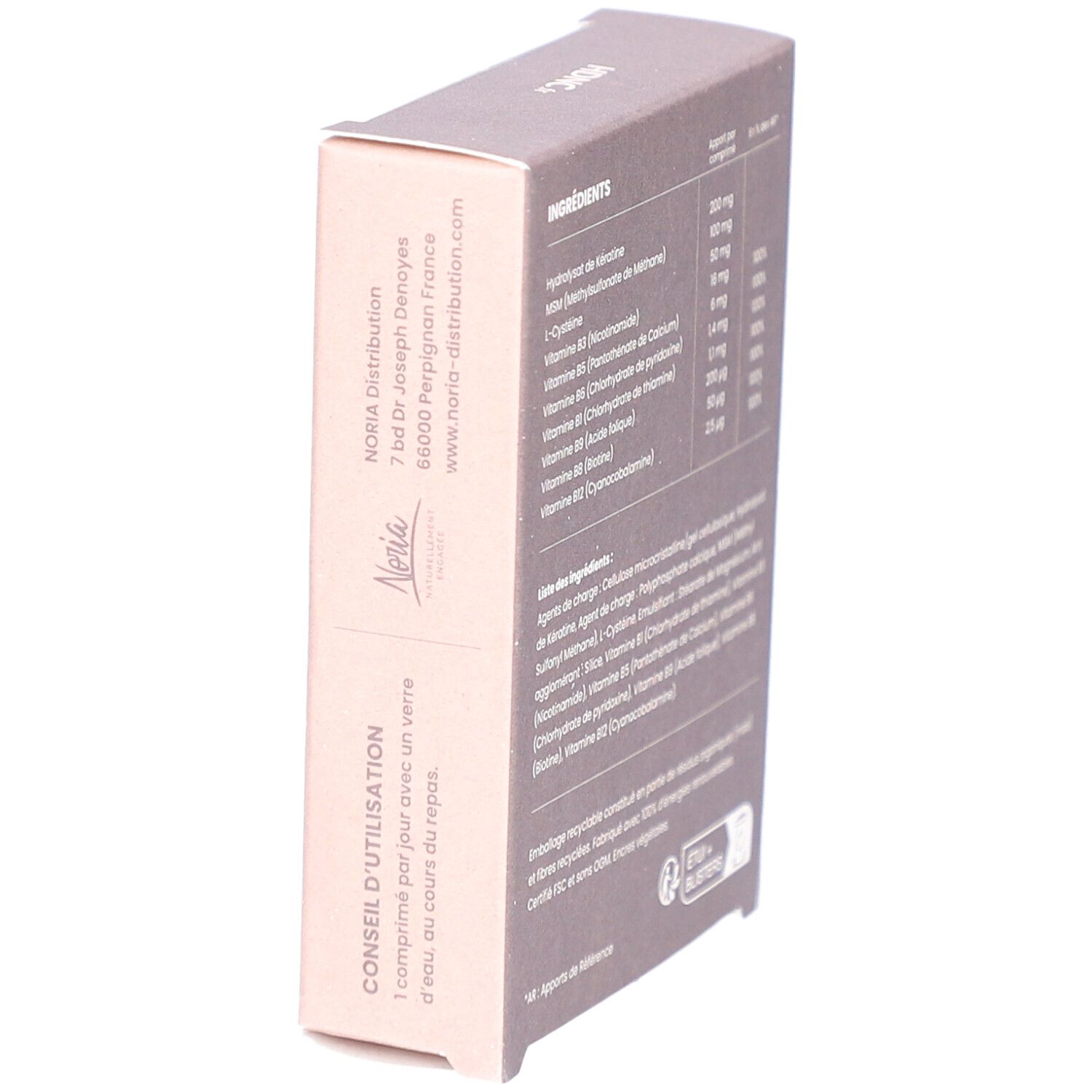 Schräg gestellte Kartonverpackung mit Inhaltsstoffen und Nährwertangaben. Enthält Hydrolysat de kératine, MSM, L-Cystein, Vitamine B.