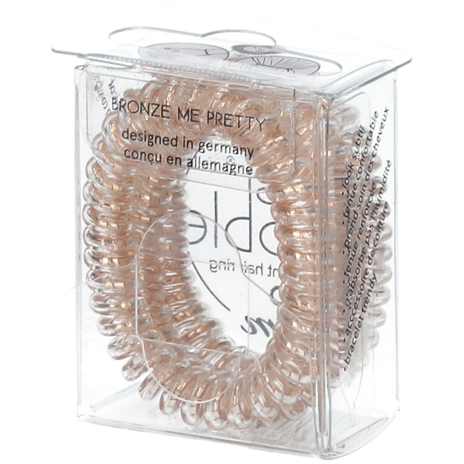 Bronze Haargummis in Spiralform in einer transparenten Verpackung. Auf der Verpackung steht "BRONZE ME PRETTY" und "designed in germany".