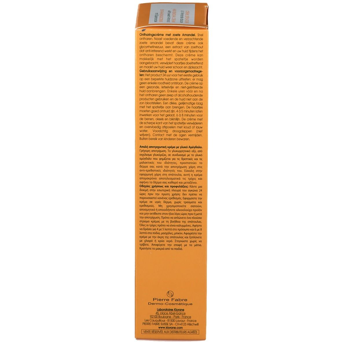 Boîte jaune. Texte multilingue. Informations fabricant et symboles de recyclage.