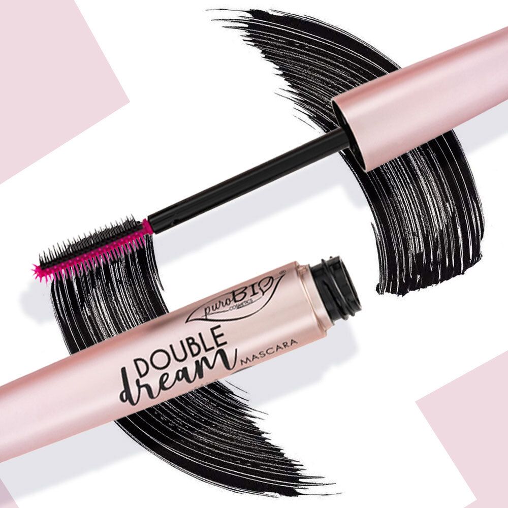 Brosse de mascara avec encre noire. Récipient rose doré, écriture noire. Inscription: Double Dream Mascara.