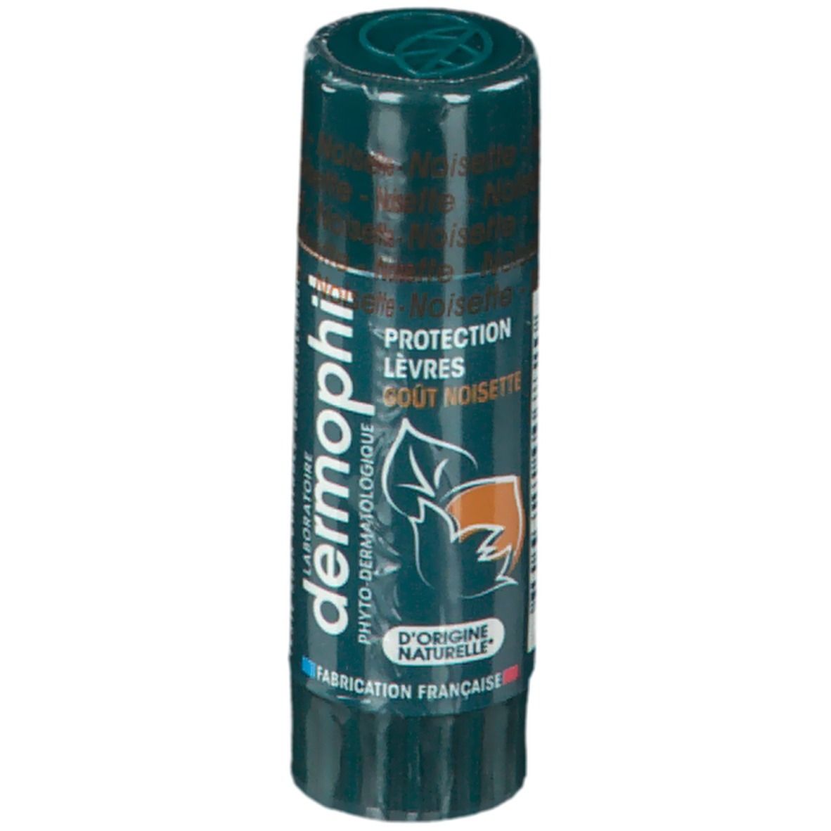 Dermophil Lippenpflegestift. Grüne Verpackung. Text: Protection Lèvres, Gout Noisette. Logo: Blatt mit Nuss. Hergestellt in Frankreich.