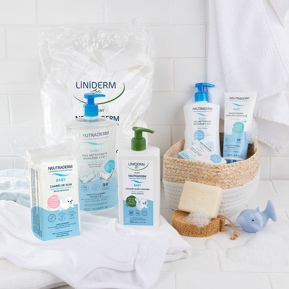 Verschiedene Neutraderm-Produkte auf weißem Hintergrund. Flaschen, Tücher und Seife. Baby-Reinigungsgel und andere Produkte.