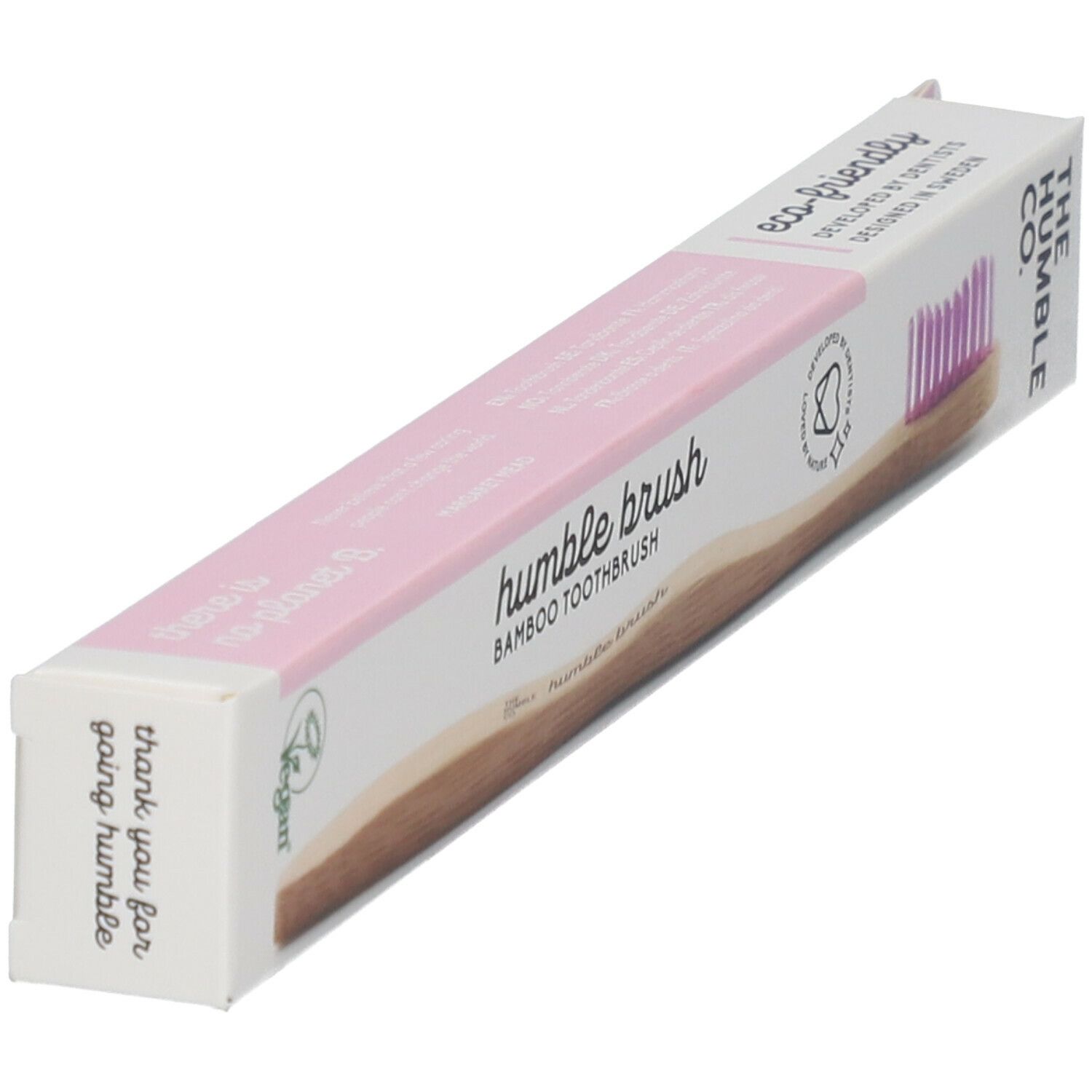 Zahnbürstenverpackung. Rosa Akzente, Bambusgriff, Logo und Text. Vegan-Siegel. Winkelansicht.