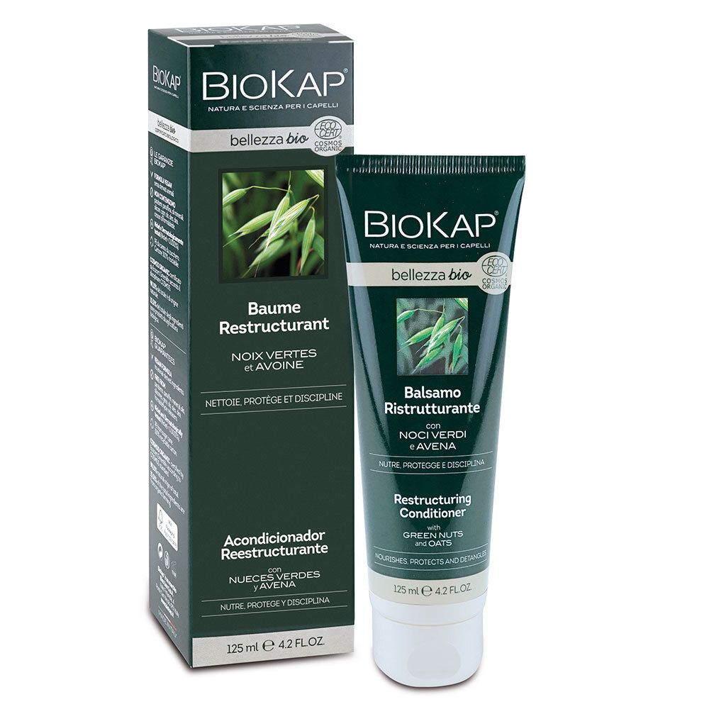 BIOKAP Baume Bio Restructurant. Tube et boîte. Vert, blanc. Texte: Baume Restructurant, Balsamo Ristrutturante, Restructuring Conditioner.