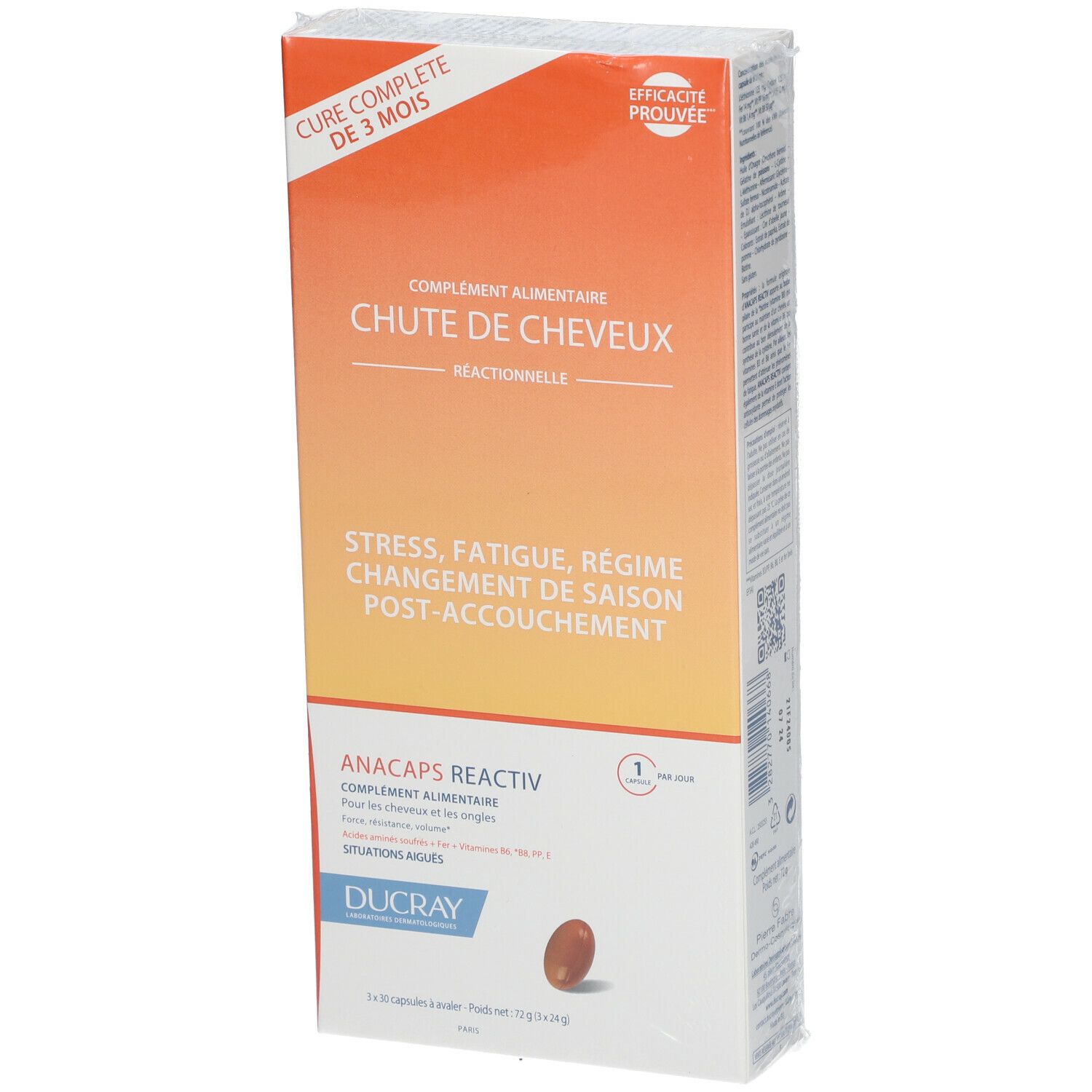 Verpackung von Nahrungsergänzungsmitteln. Text: CHUTE DE CHEVEUX, ANACAPS REACTIV, DUCRAY. Orange-weißes Design. Kapsel-Abbildung. Teilweise transparente Folie.