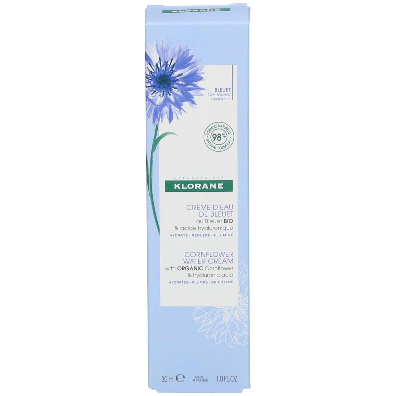 Boîte bleu clair avec fleur bleue et texte. Contient Crème d'Eau de Bleuet. 30ml. 98% d'ingrédients naturels.