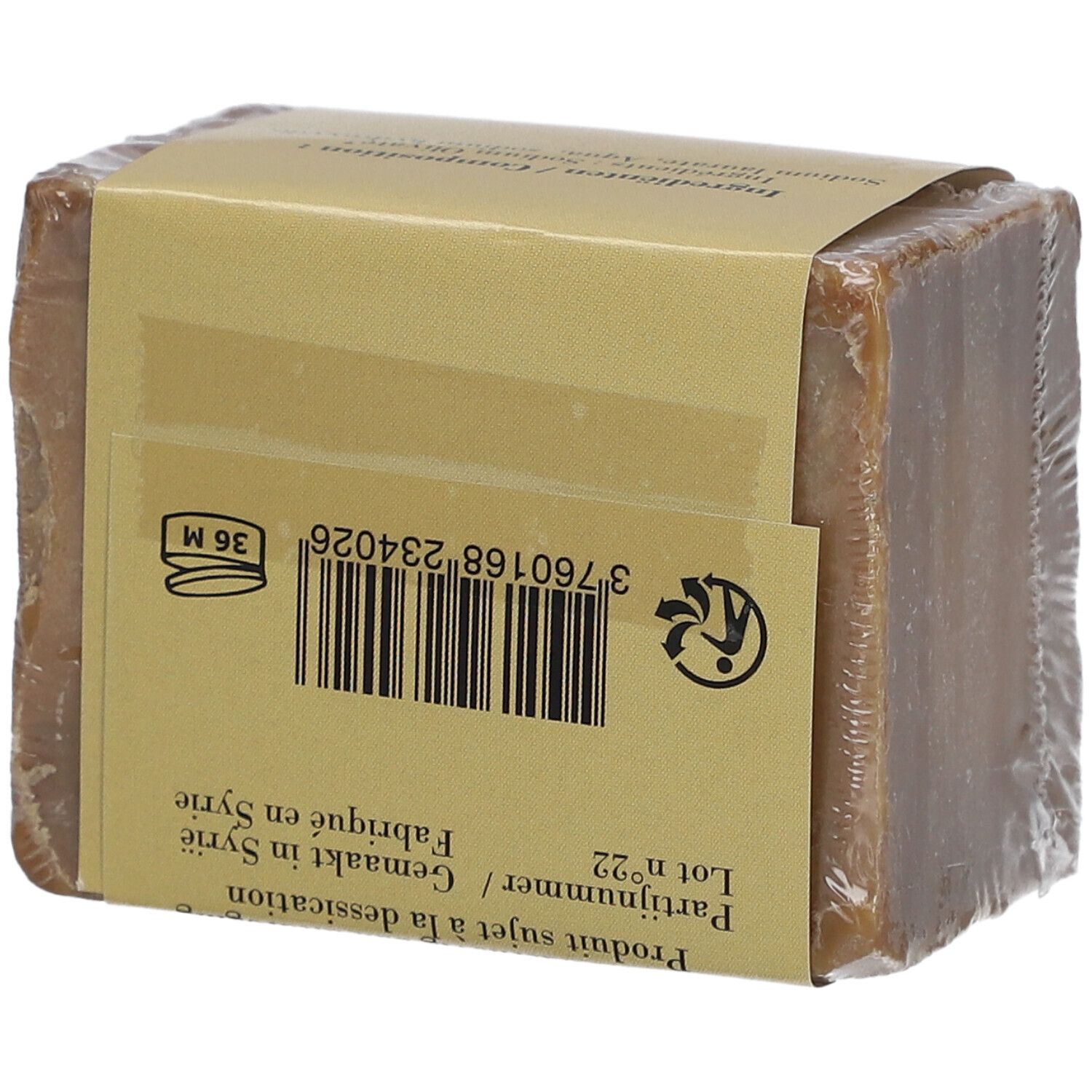 Bloc de savon emballé. Verso de l'emballage avec code-barres, symbole de recyclage et texte.