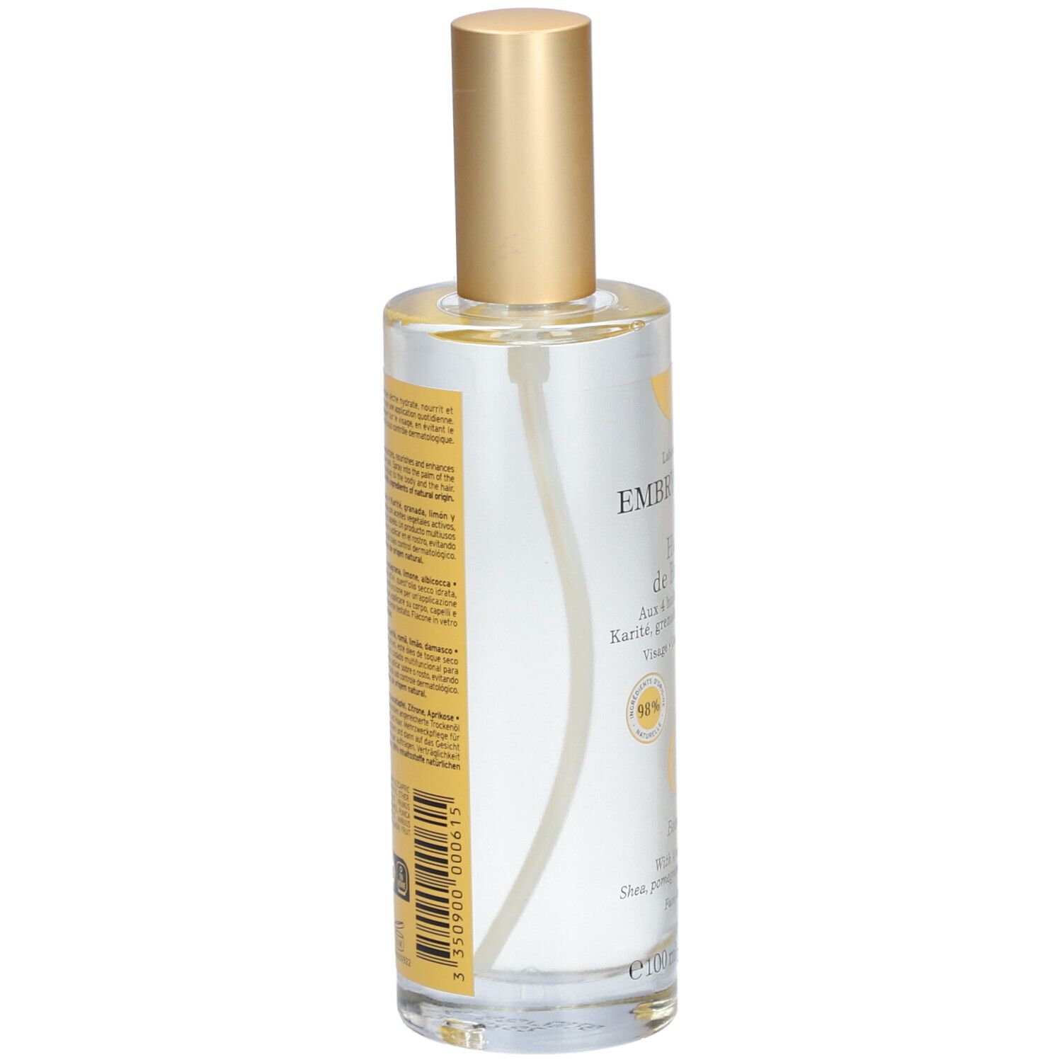 Klare Glasflasche mit goldfarbenem Sprühkopf. Aufschrift: EMBRYOLISSE Huile de Beauté. Rückseite mit Text und Barcode.