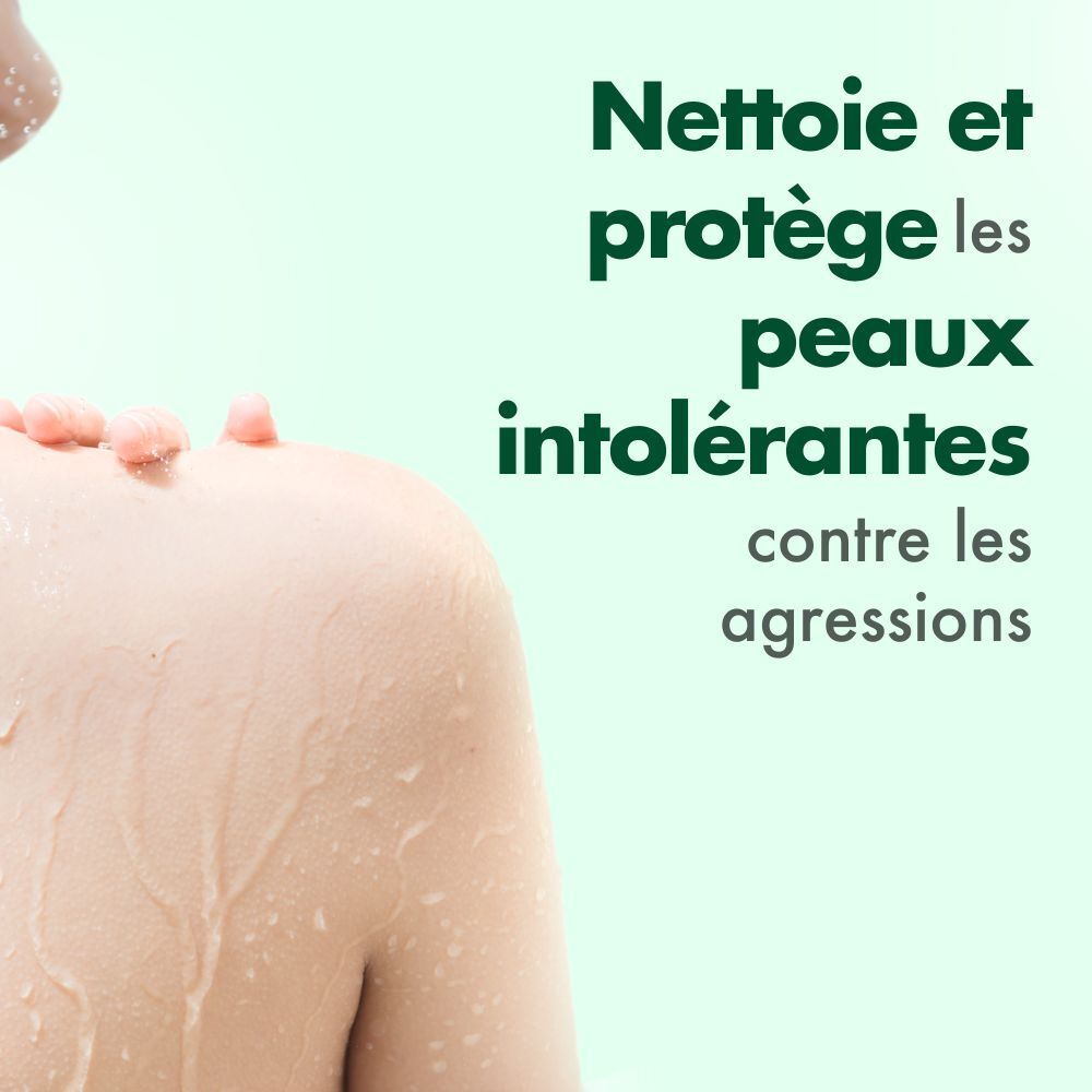 Hautpartie mit Wasser. Text: Nettoie et protège les peaux intolérantes contre les agressions. Hintergrund: Hellgrün.
