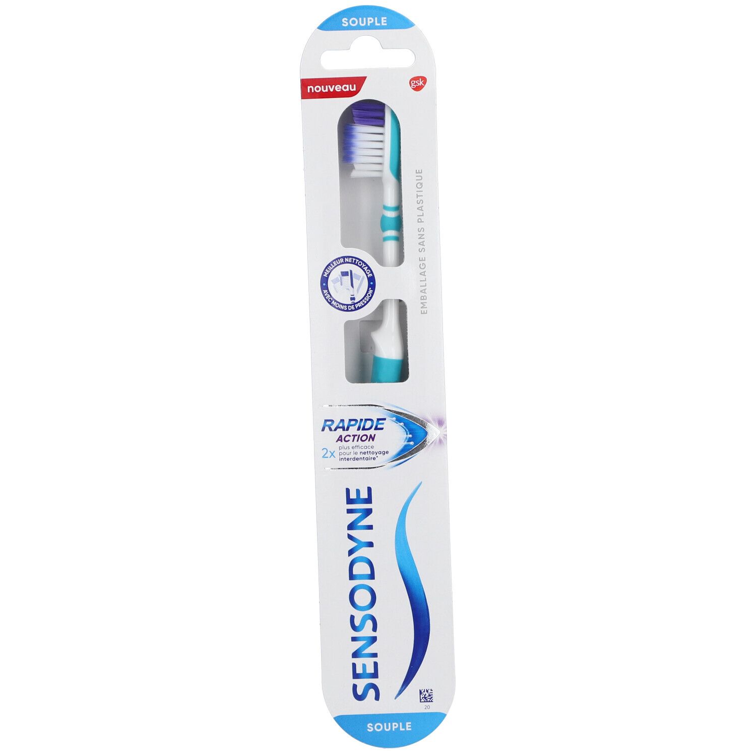 Brosse à dents dans emballage. Turquoise et blanc, soies violettes. Emballage avec nom du produit et "NOUVEAU".