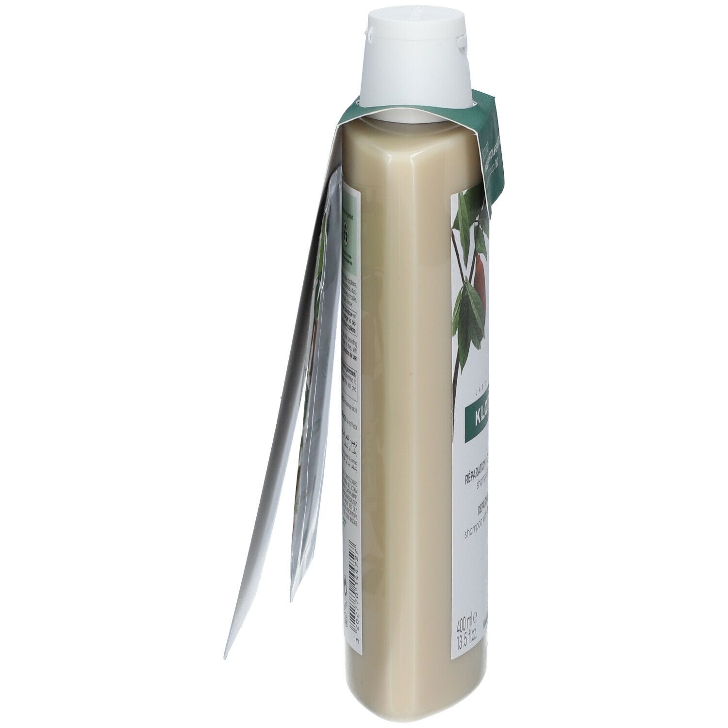 Flacon de shampooing avec étiquette. Flacon beige à bouchon blanc. Étiquette avec logo et texte. Étiquette avec texte.
