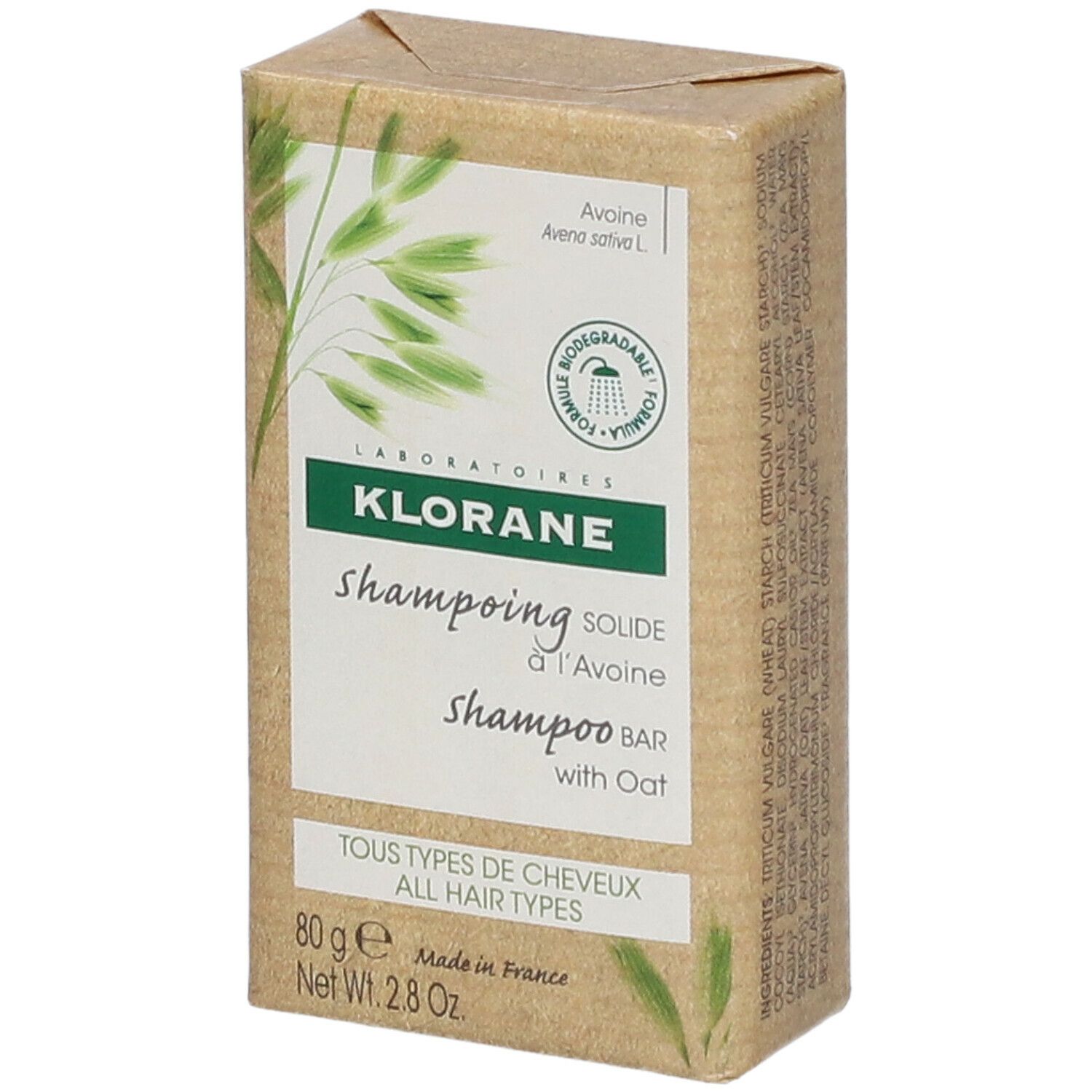 Emballage carton avec KLORANE shampooing solide à l'Avoine. Inscription: Tous types de cheveux.