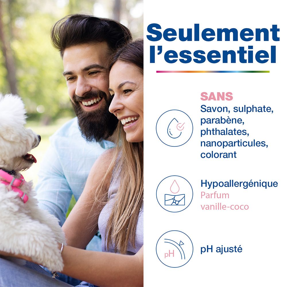 Homme et femme avec chien. Texte: Seulemen l'essentiel. Sans: Savon, sulfate, parabène, phtalates, nanoparticules, colorant.