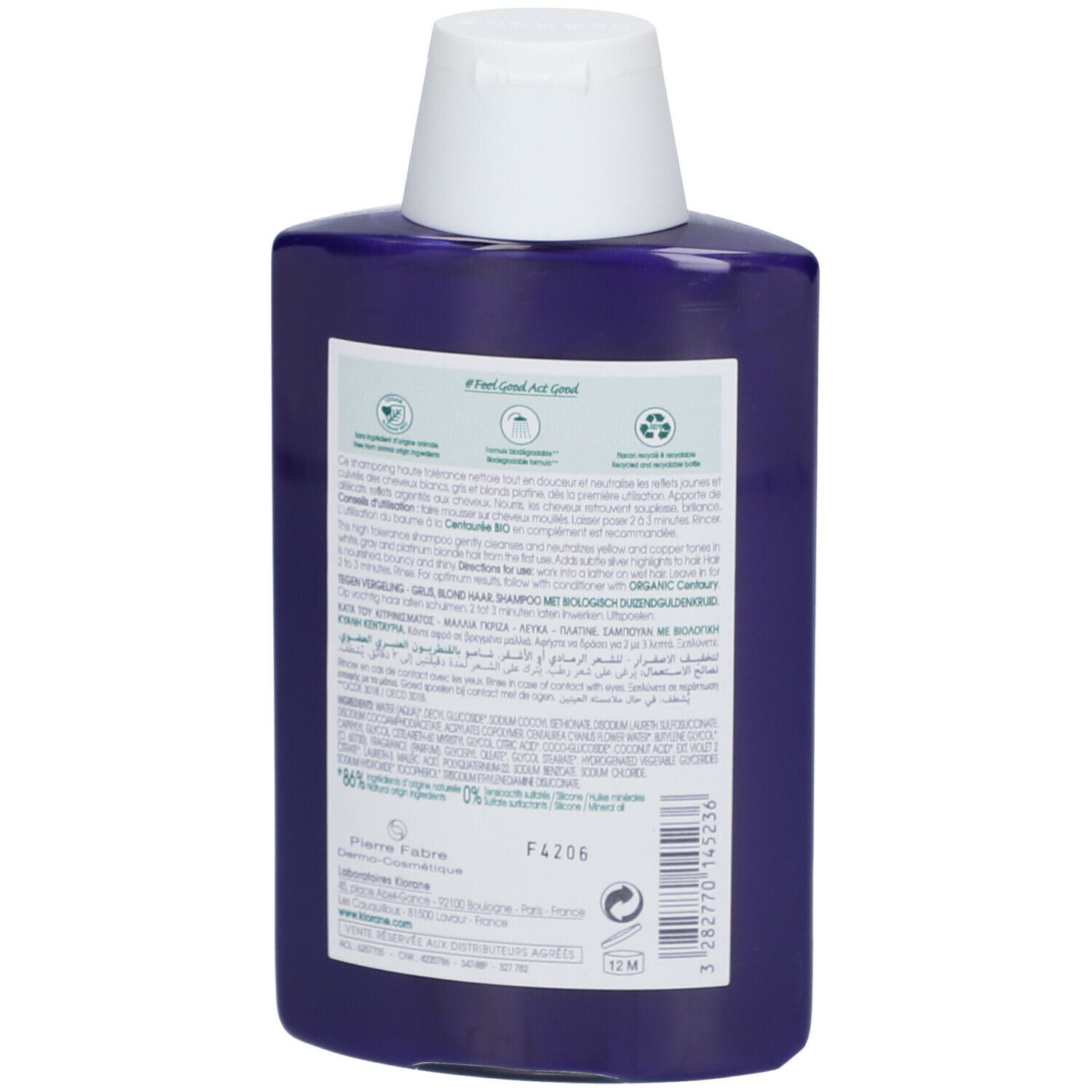 Dos d'un flacon de shampooing bleu. Texte : informations sur le produit, ingrédients, adresse du fabricant, symbole de recyclage. Symbole 12M.