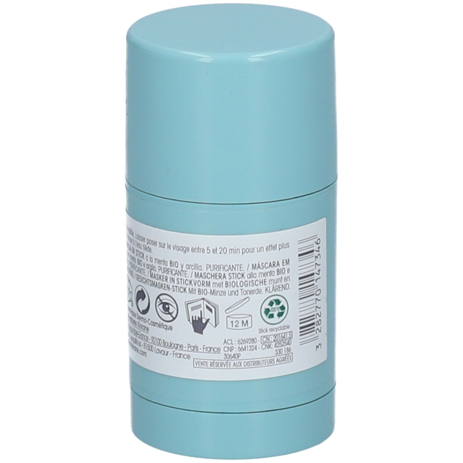 Dos du masque en stick bleu clair. Texte multilingue. Logos cosmétiques, symbole 12M et symbole de recyclage.