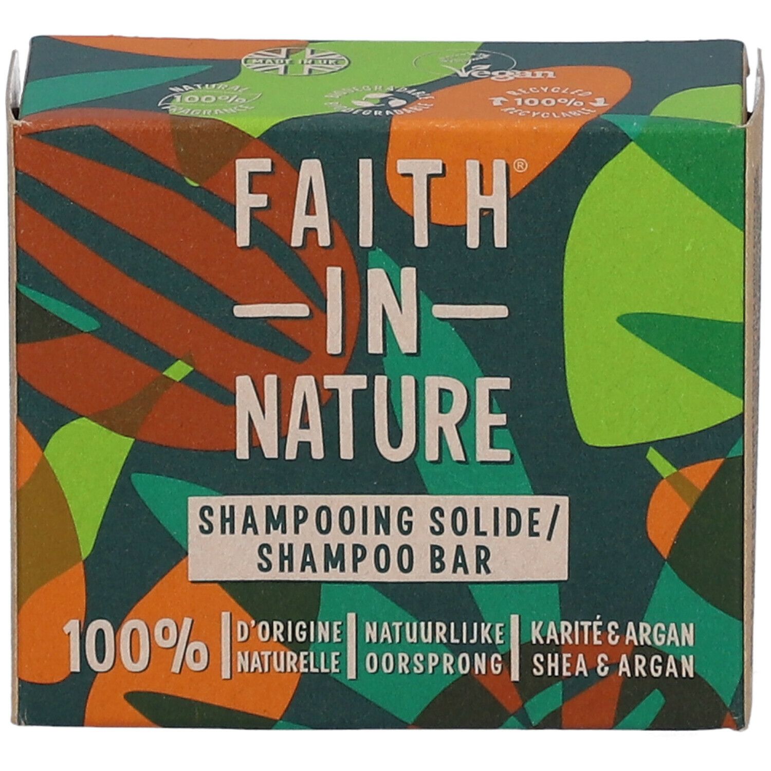 Boîte en carton avec logo "FAITH IN NATURE". Texte "Shampooing Solide/Shampoo Bar". Mention "Shea & Argan". Vert, marron et orange.