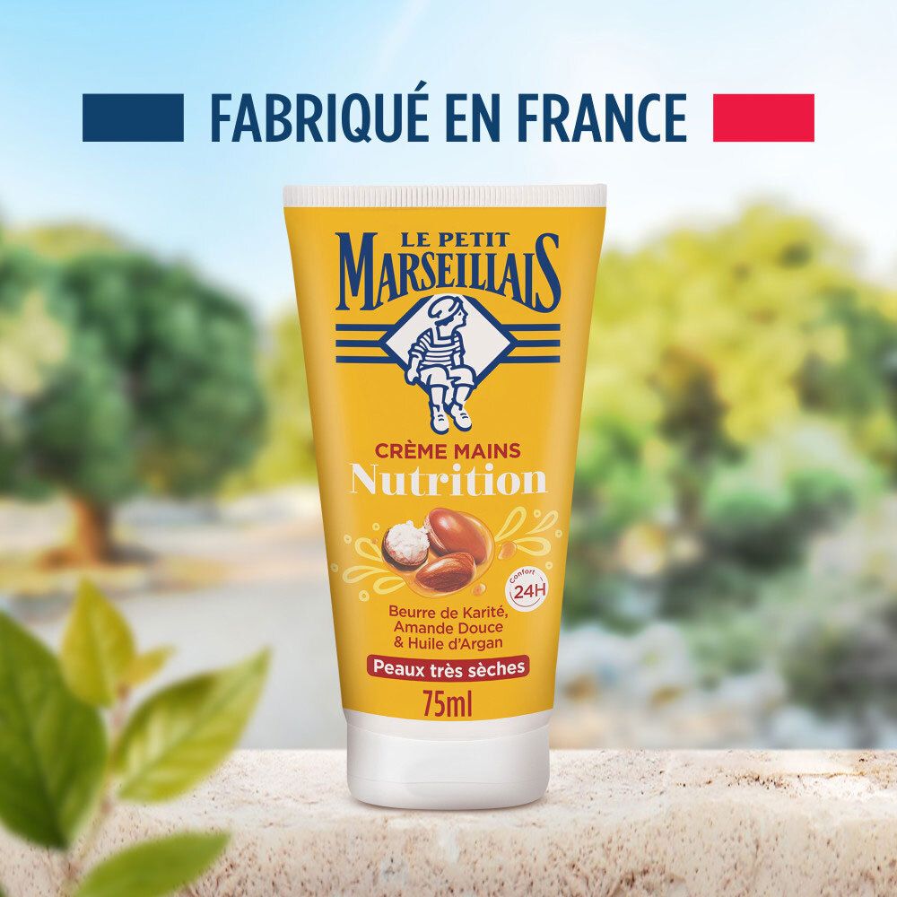 Le Petit Marseillais Handcreme Tube vor einer Landschaftskulisse, mit Hinweis 'Hergestellt in Frankreich'.