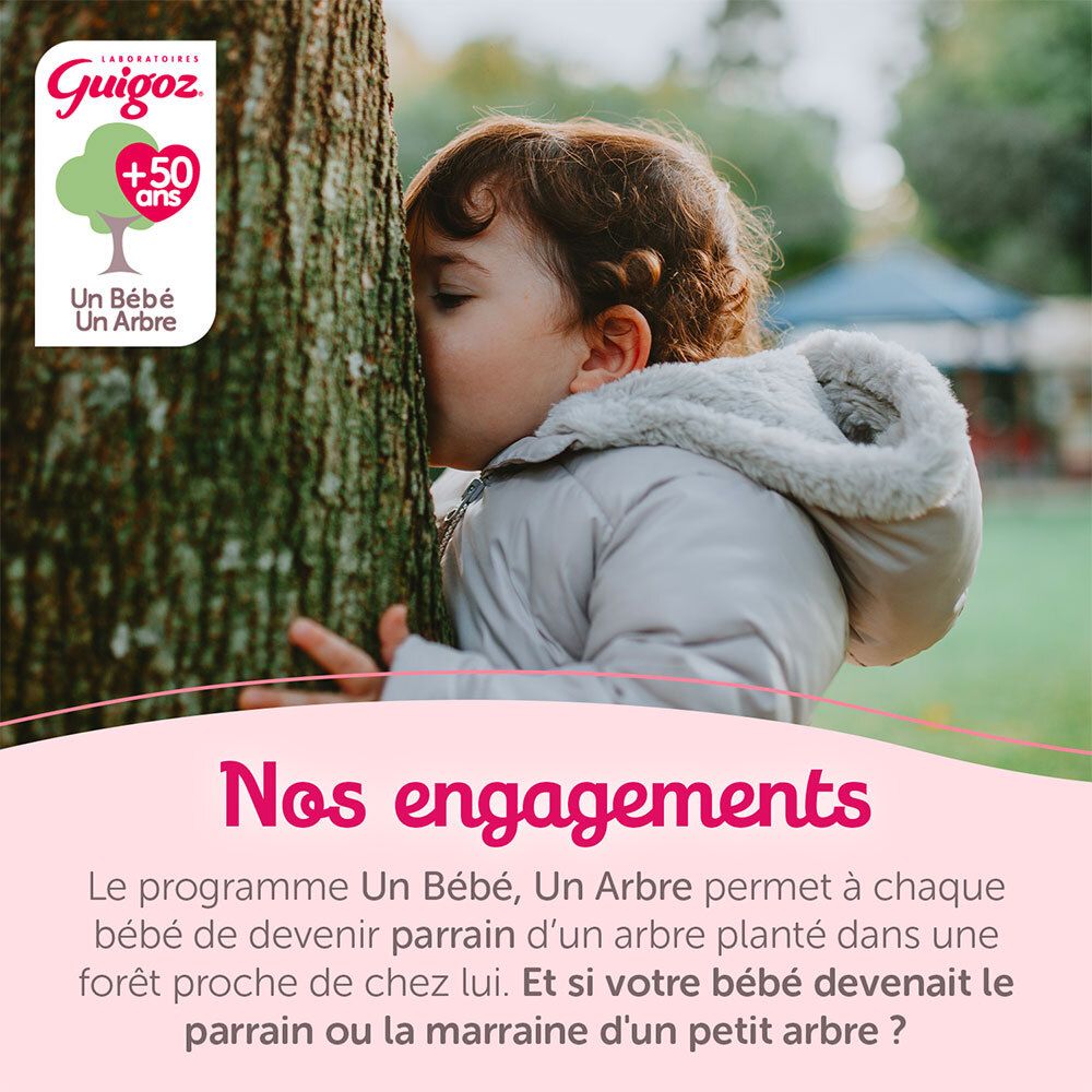 Enfant embrassant un arbre. Engagement Guigoz : Un bébé, un arbre. Programme de plantation d'arbres.
