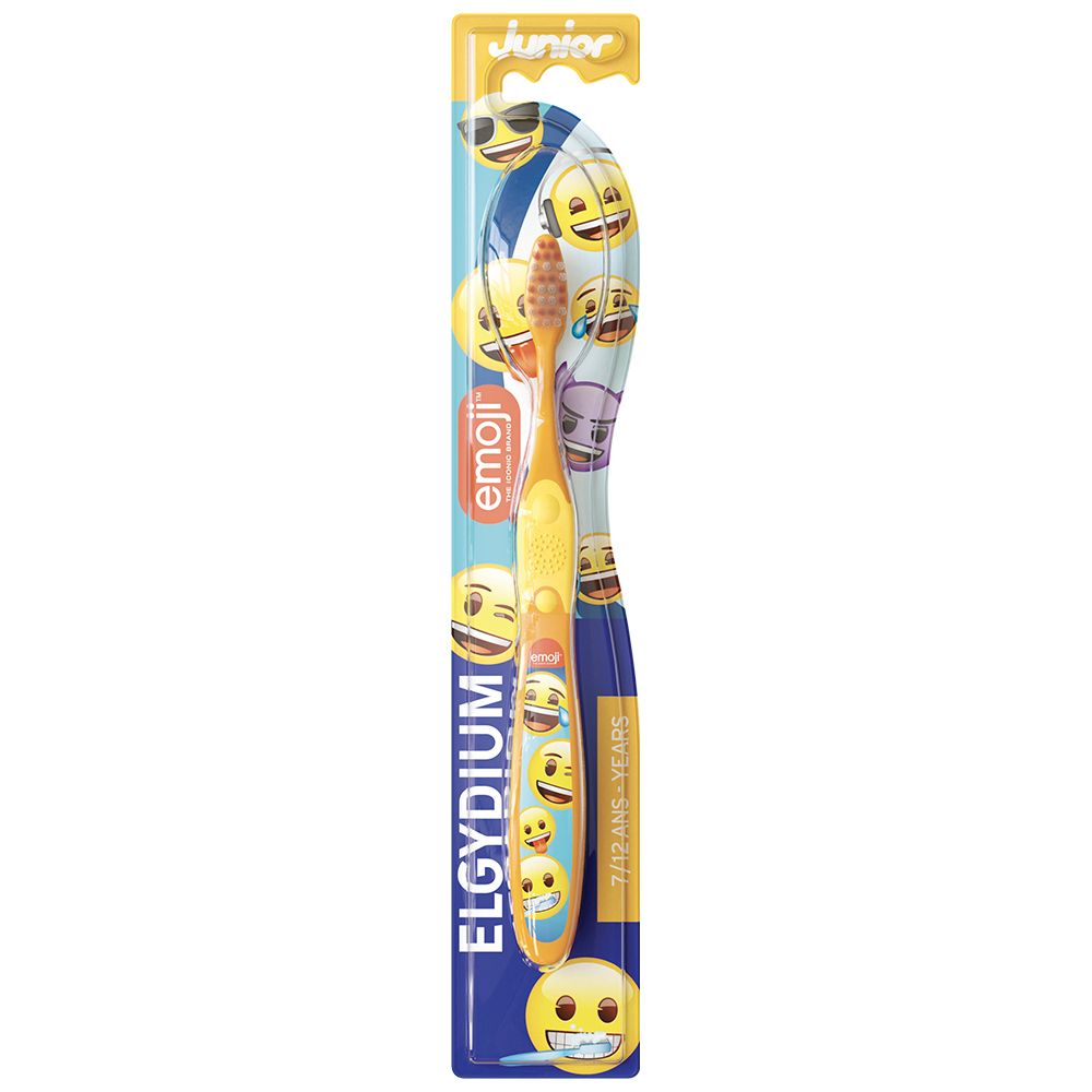 Brosse à dents jaune avec motifs Emoji et inscription "ELGYDIUM Junior".