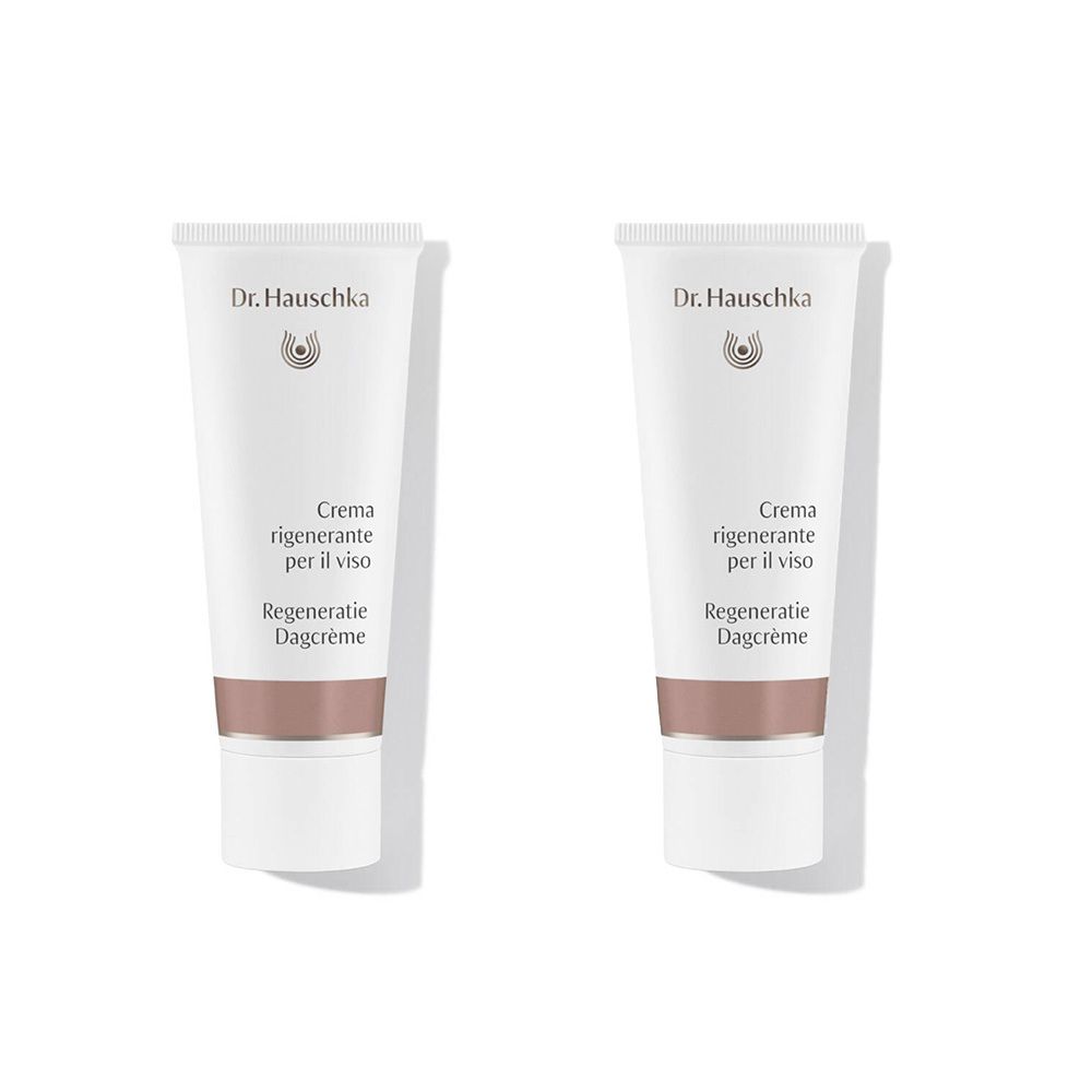 Deux tubes de crème blancs avec une bande marron. Marque Dr. Hauschka. Texte: Crema rigenerante per il viso, Regeneratie Dagcrème.
