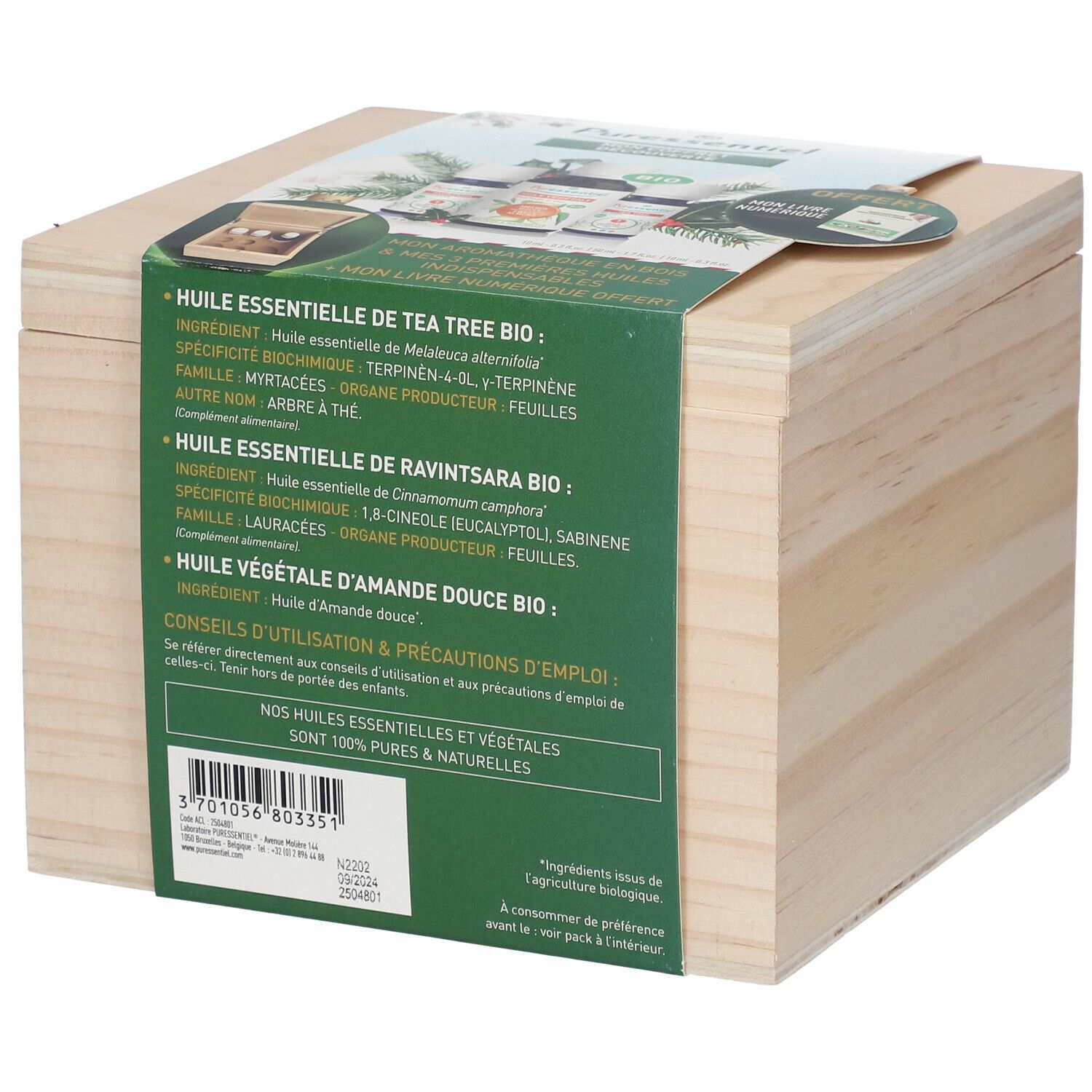Holzkiste mit Produktinformationen. Aufschrift: "Huile essentielle de Tea Tree Bio".