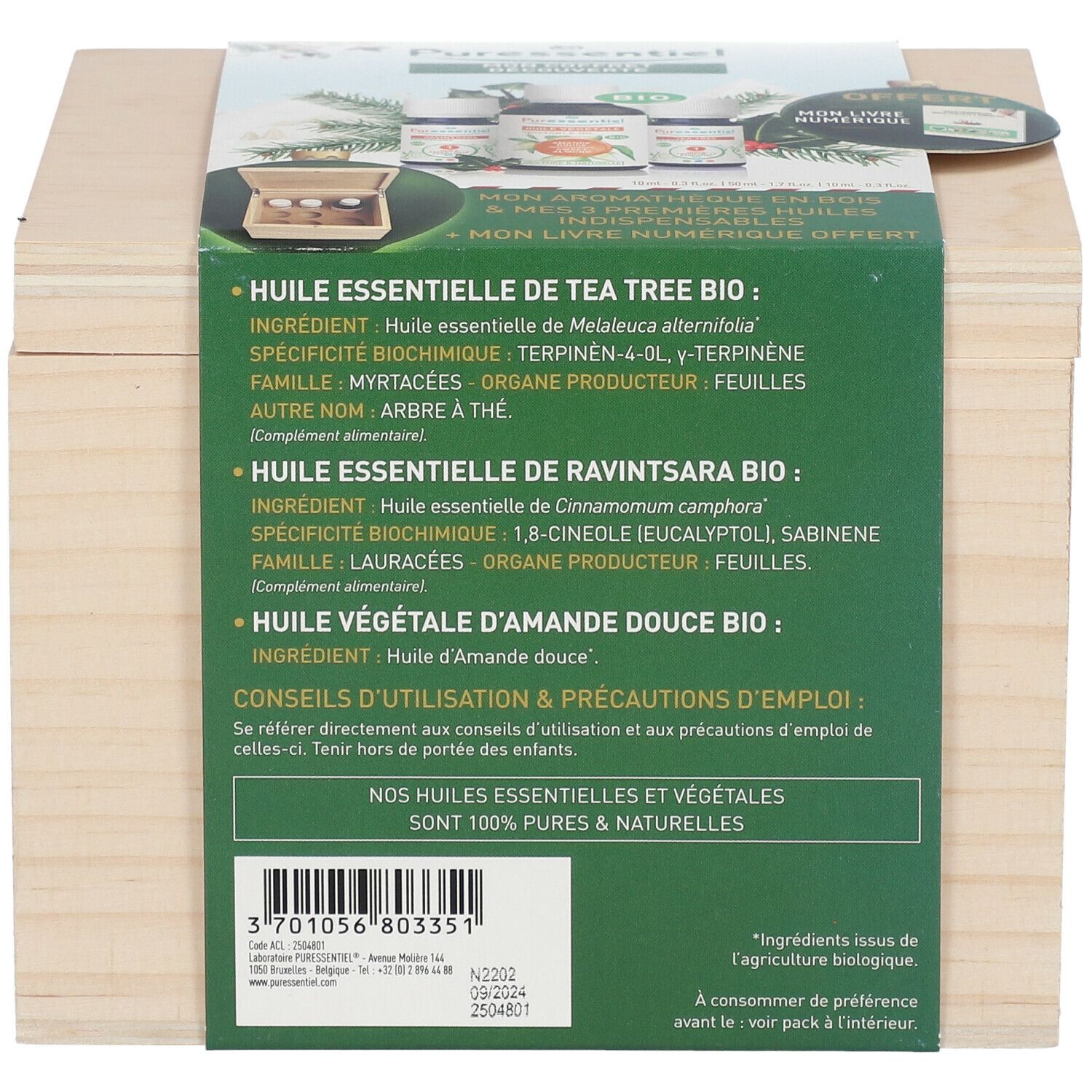 Holzkiste mit Produktinformationen. Aufschrift: "Huile essentielle de Tea Tree Bio".