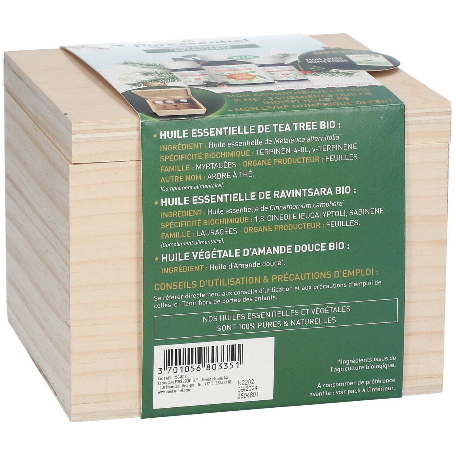 Holzkiste mit Produktinformationen. Aufschrift: "Huile essentielle de Tea Tree Bio".