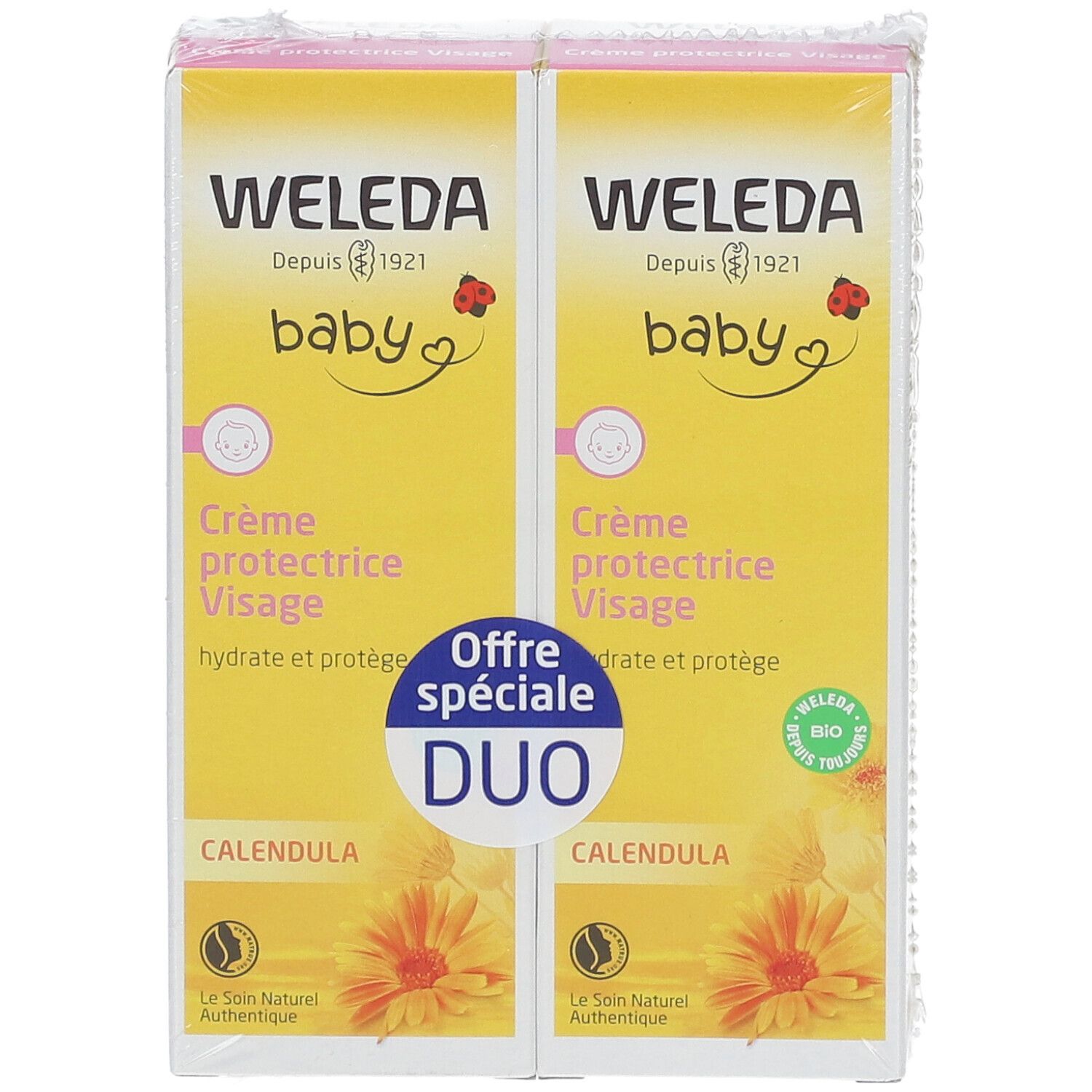 Zwei gelbe Kartons mit Text. Aufschrift: WELEDA Baby Crème protectrice Visage. Duo-Packung mit Calendula-Blüten.