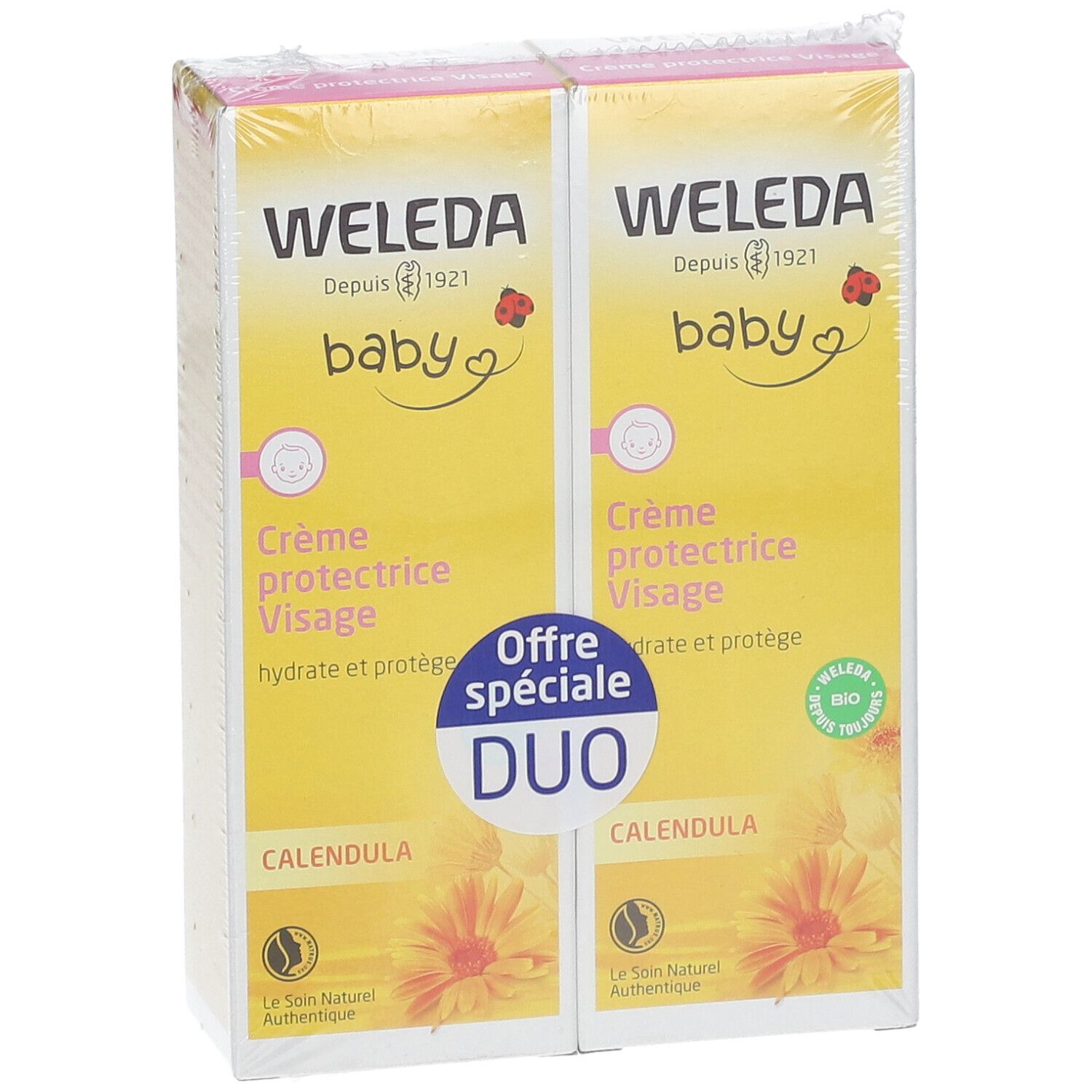 Zwei gelbe Kartons mit Text. Aufschrift: WELEDA Baby Crème protectrice Visage. Duo-Packung mit Calendula-Blüten.