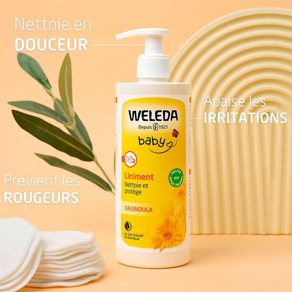 Gelbe Flasche WELEDA baby LINIMENT. Text: Nettoie en DOUCEUR, Apaise les IRRITATIONS, Prévient les ROUGEURS. Blätter und Wattepads.