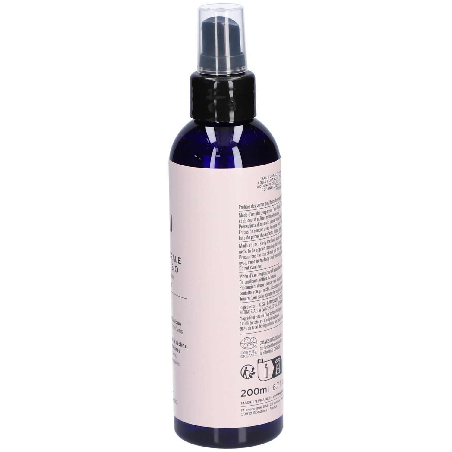 Flacon pulvérisateur bleu foncé avec étiquette rose. Texte au dos. Informations, ingrédients et instructions.