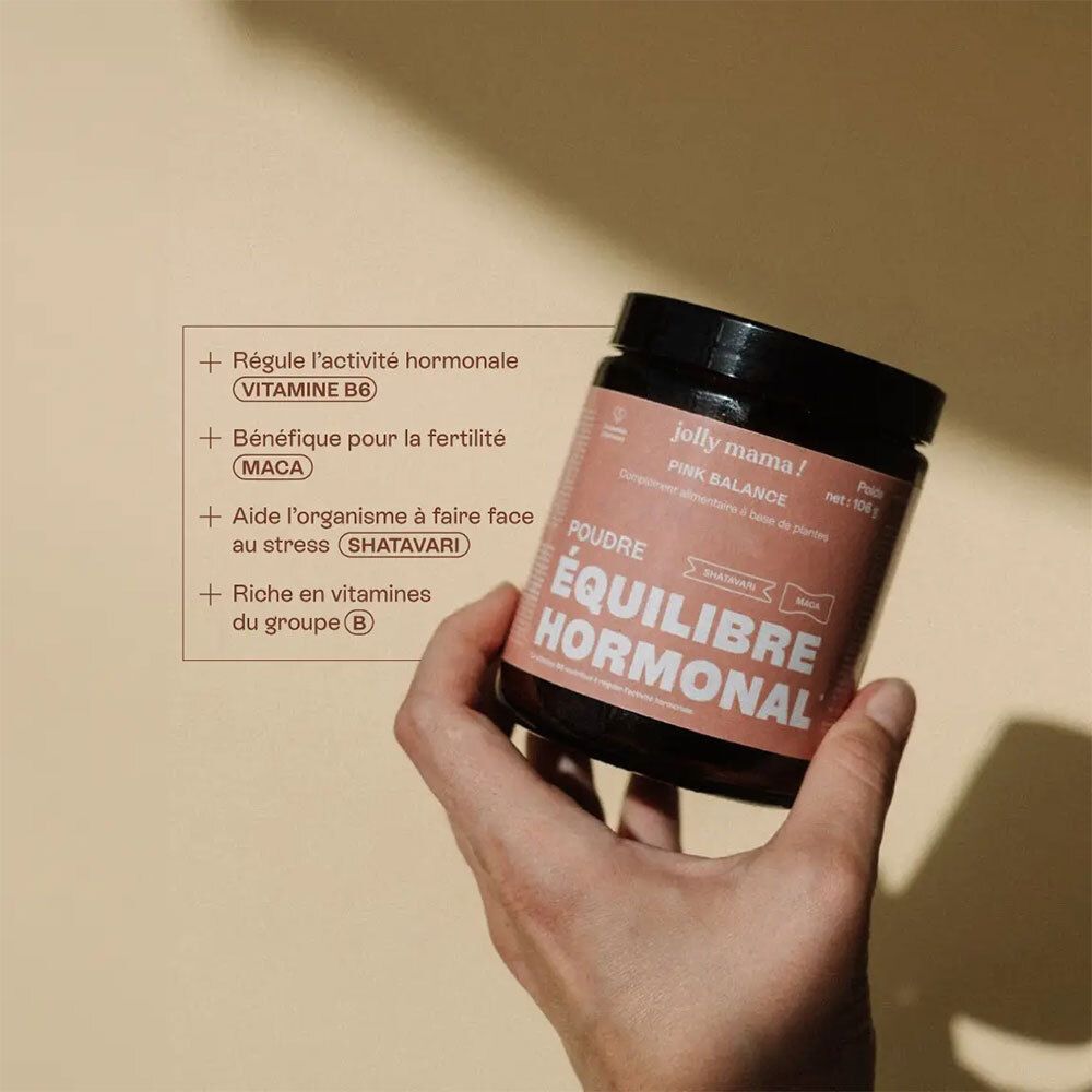 Hand hält Dose mit Aufschrift JOLLY MAMA Pink Balance. Text: Poudre ÉQUILIBRE HORMONAL. Aufschrift: Vitamine B6.