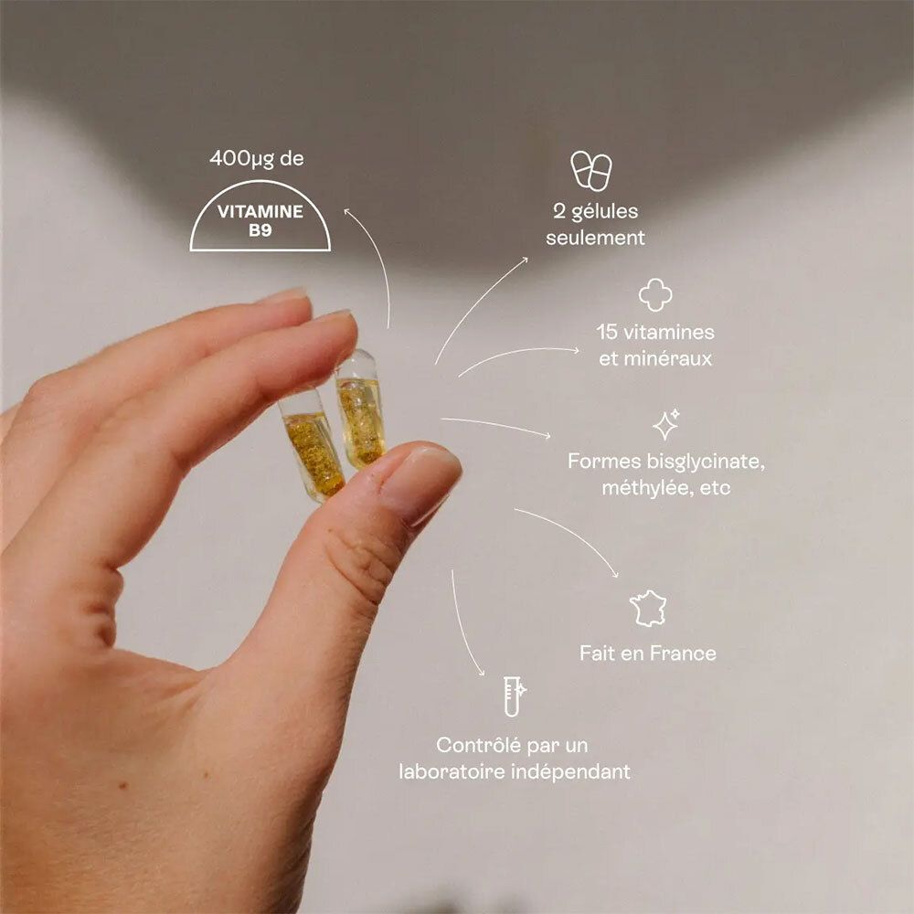 Deux capsules dans la main. Texte: "400µg de vitamine B9".