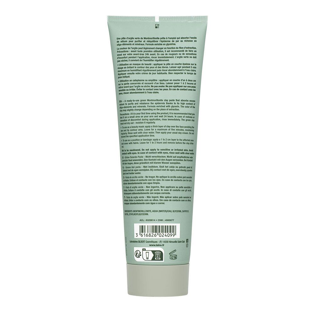 Rückseite der Tube mit grüner Tonerde-Paste. Text in mehreren Sprachen. Herstellerinformationen und Logos.