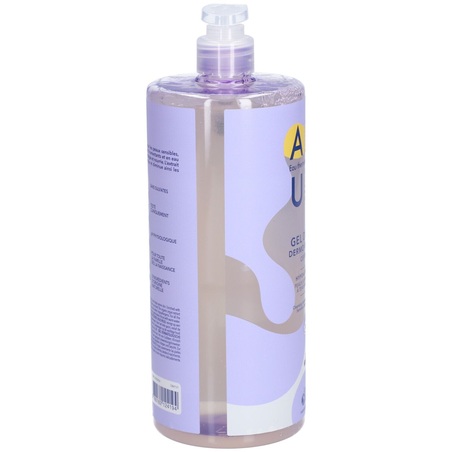 Flacon de gel douche, vue latérale. Étiquette violette avec texte et ingrédients. Pompe en haut.