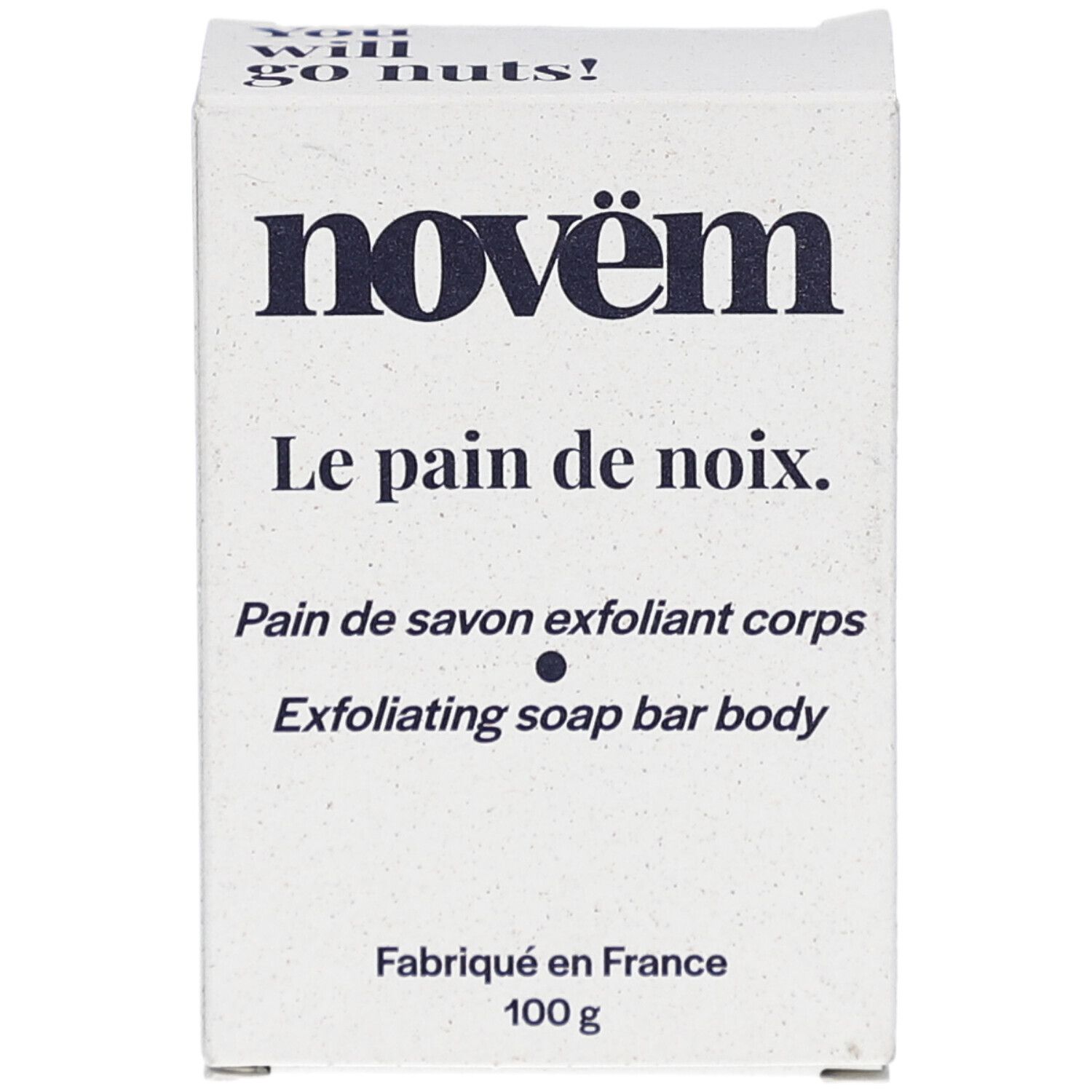 Weiße Kartonverpackung. Aufschrift: novëm, Le pain de noix, Pain de savon exfoliant corps, Exfoliating soap bar body. Hergestellt in Frankreich, 100 g.