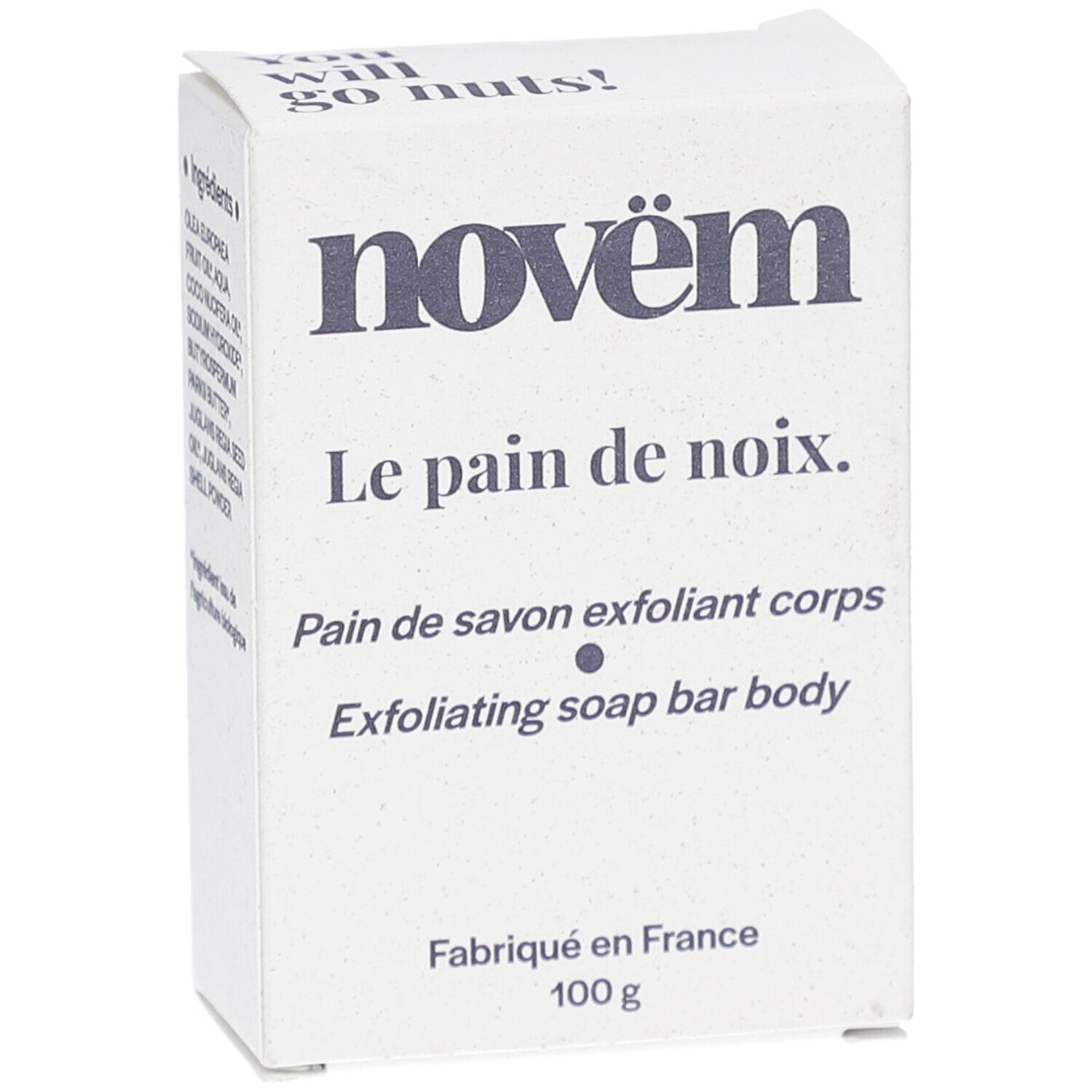 Weiße Kartonverpackung. Aufschrift: novëm, Le pain de noix, Pain de savon exfoliant corps, Exfoliating soap bar body. Inhaltsstoffe, 100 g.