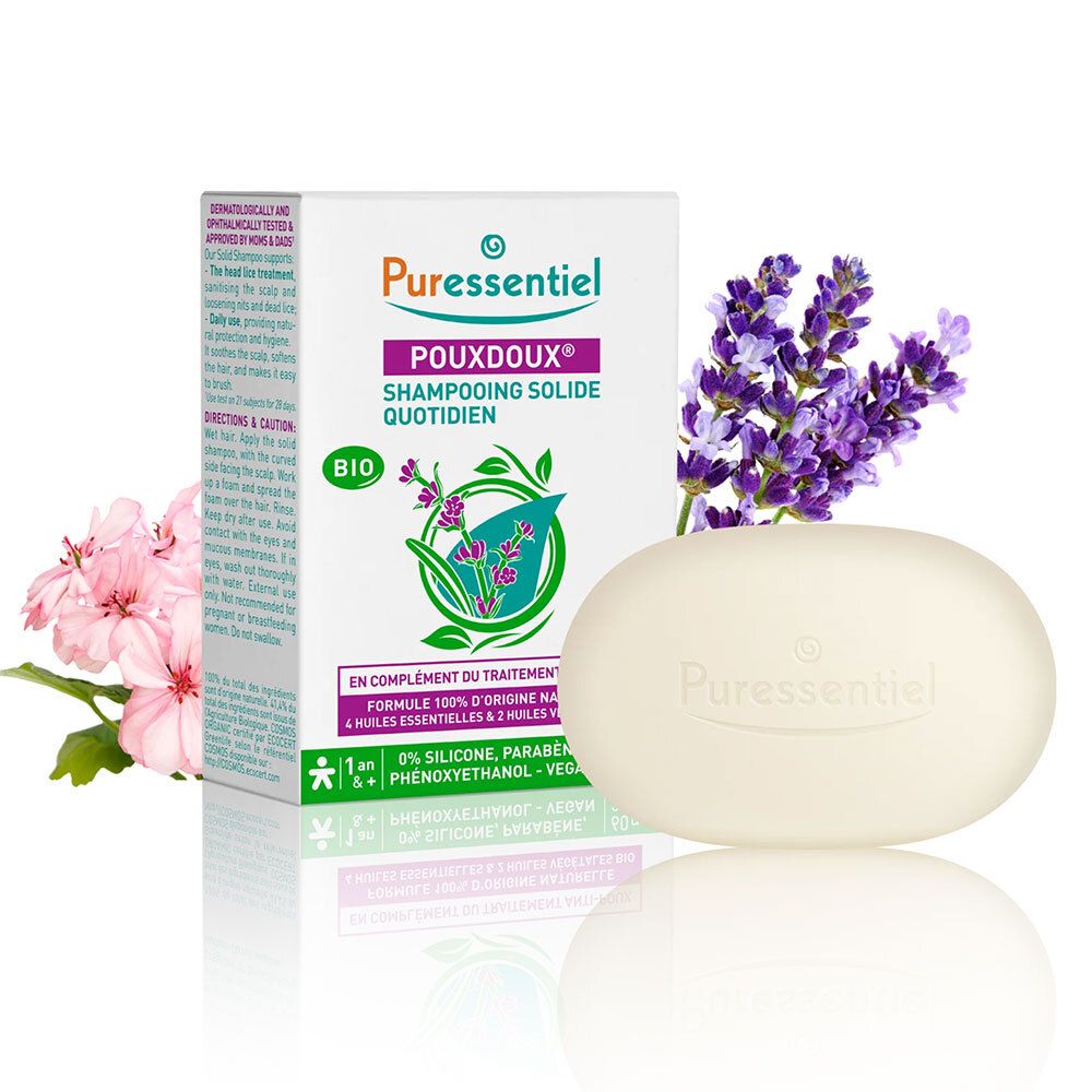 Shampooing solide Puressentiel Pouxdoux® et emballage avec fleurs. Certification bio.