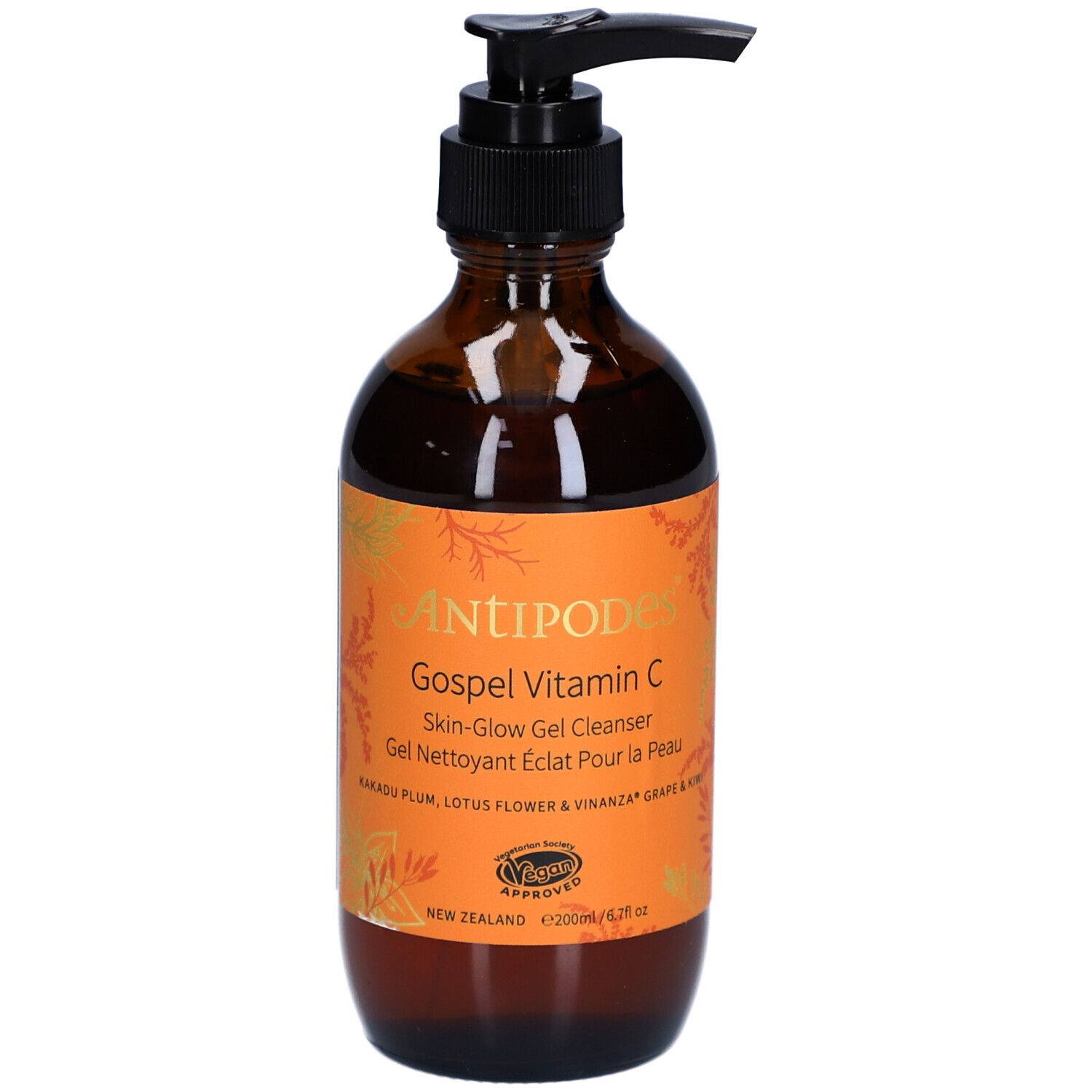 Flacon en verre brun avec pompe noire. Étiquette orange avec nom du produit et texte. Certification végétalienne.
